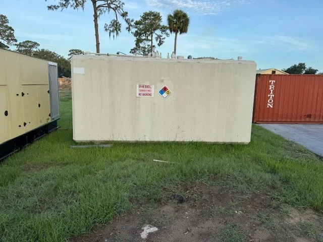 White fuel tank with hazardous materials warning signs
