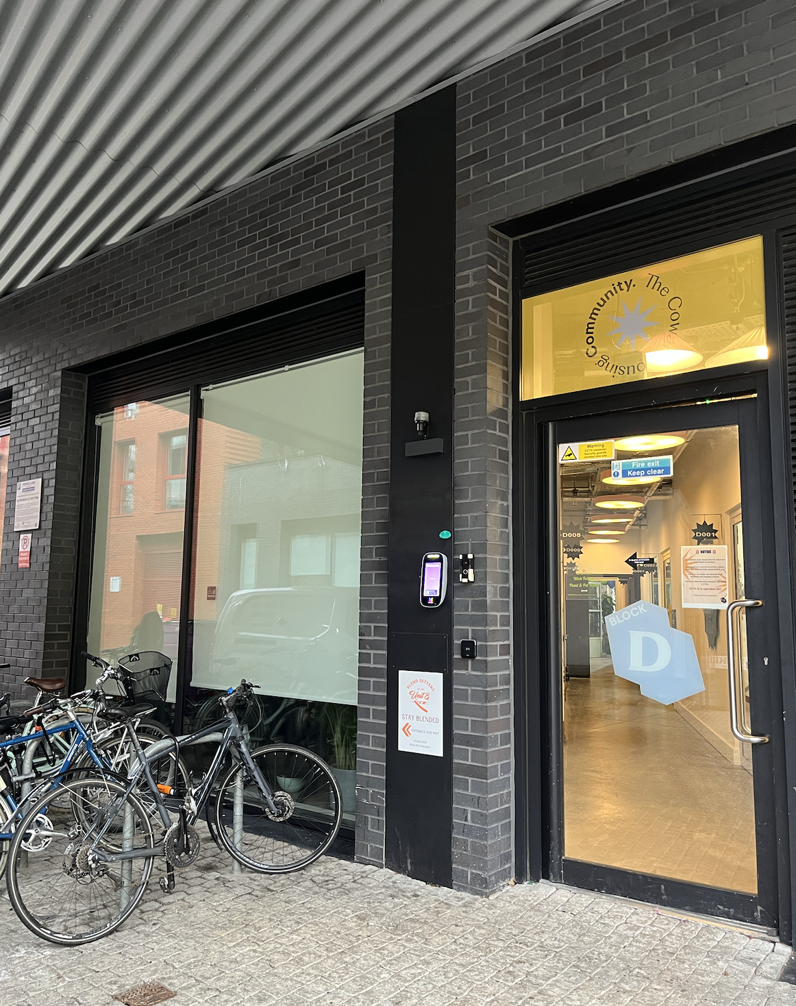 Enter through the “Block D” door, then follow through to Unit D009.