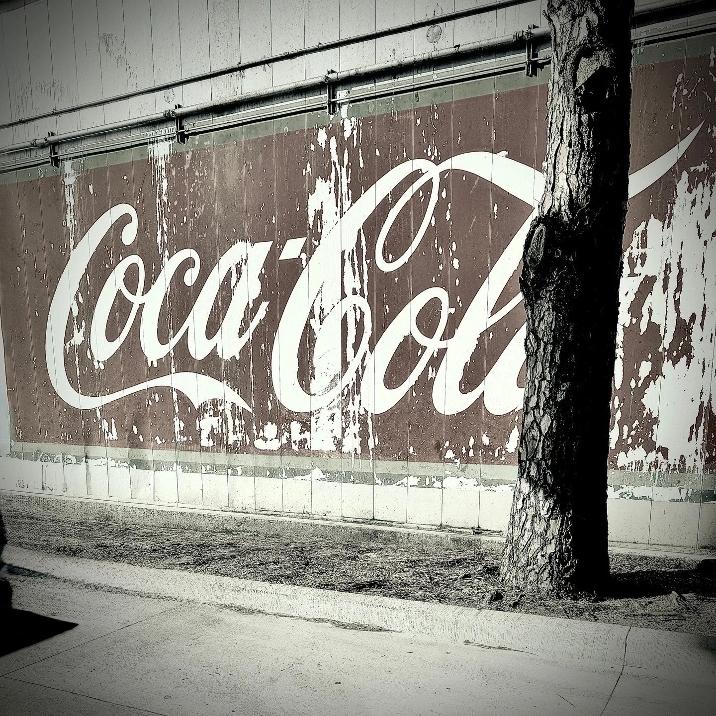 Saw this on the side of a restaurant while pumping gas and couldn't stop staring. 📸

the paint is peeling, a tree is growing in front of it, and you still know exactly what it is.

that's what a well-designed brand does. it doesn't need perfect cond