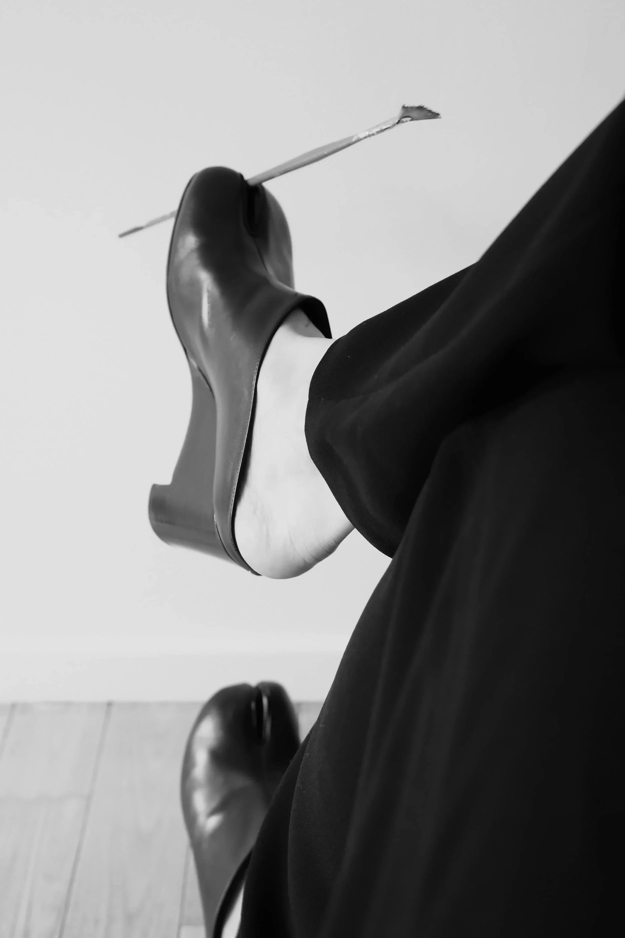 Close-up of tabi shoes holding a paint brush