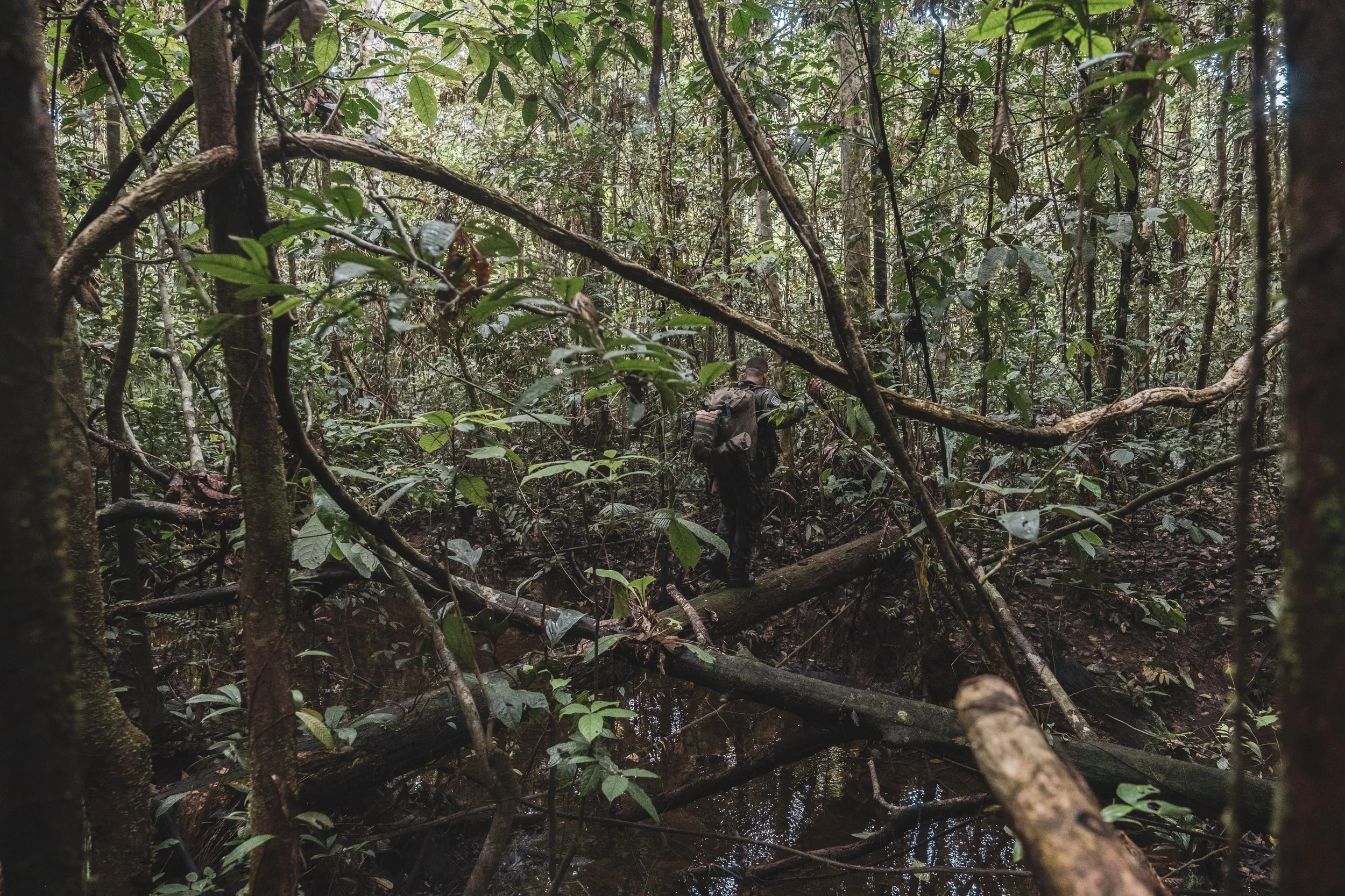 Members of the Brazilian Army’s special unit Selva patrol a jungle trail along the Colombian border where Brazilian forces recently engaged with the Colombian narco-guerrilla group Comando de la Frontera, accused of smuggling drugs into Brazil.