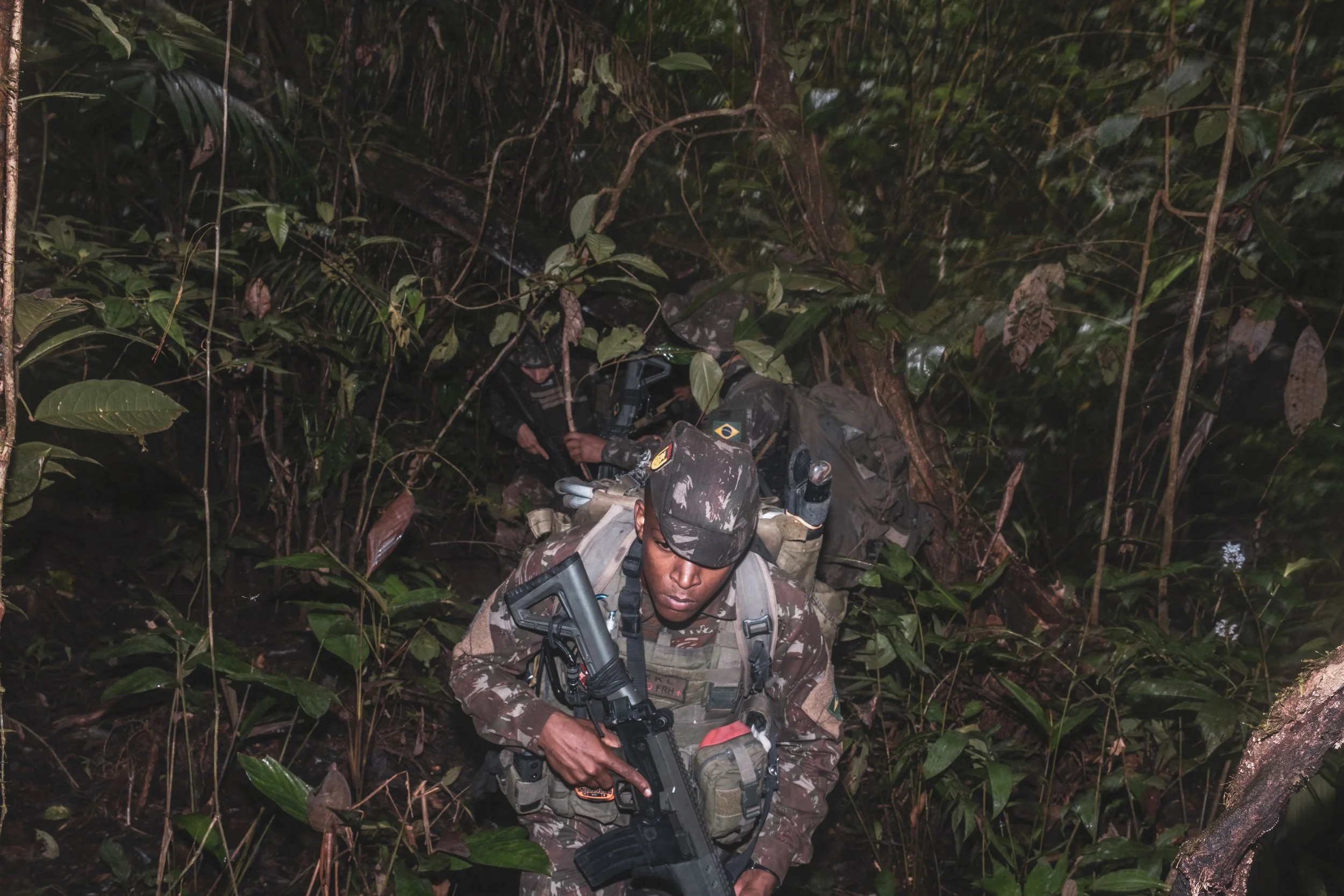 Members of the Brazilian Army’s special unit Selva patrol a jungle trail along the Colombian border where Brazilian forces recently engaged with the Colombian narco-guerrilla group Comando de la Frontera, accused of smuggling drugs into Brazil.