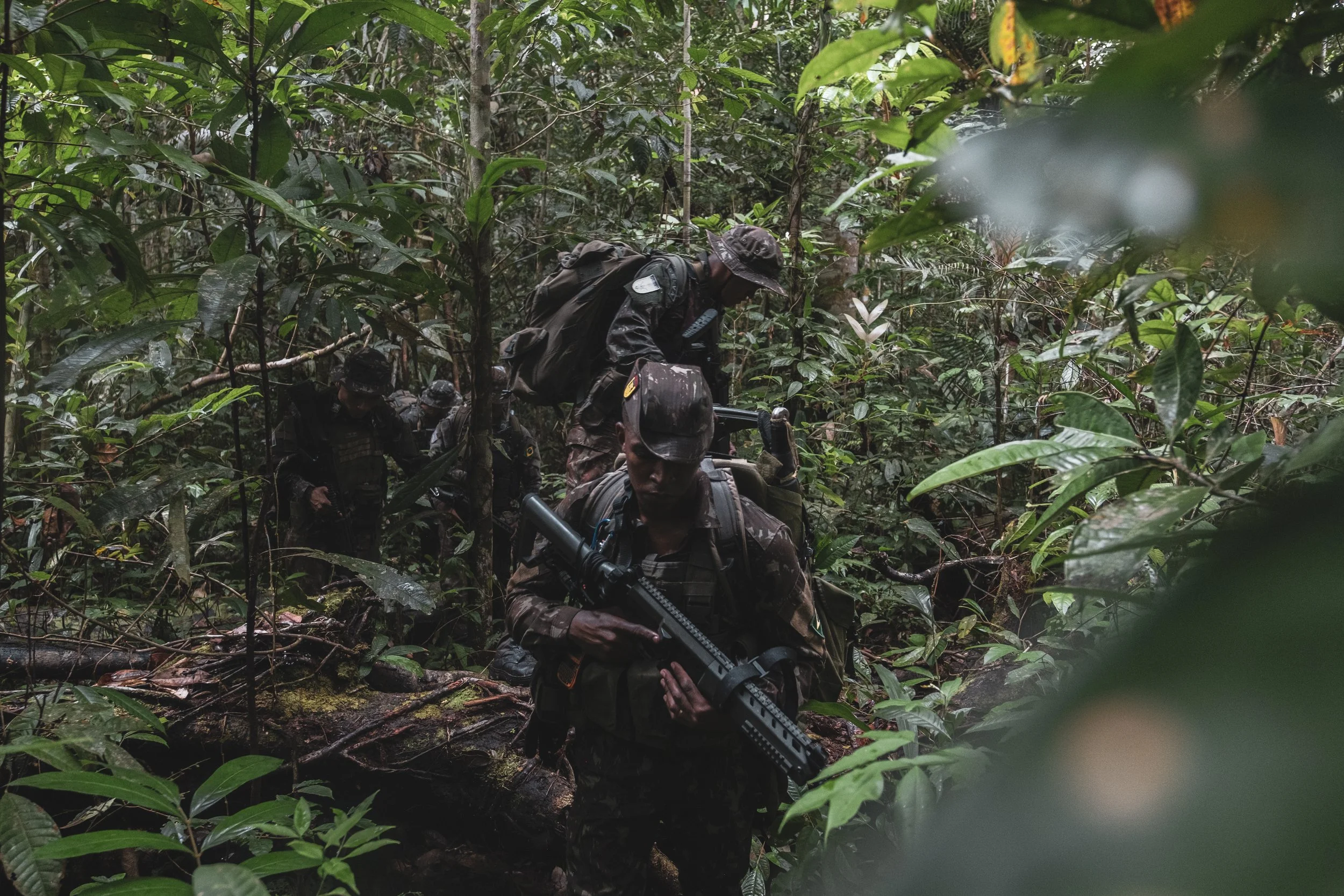 Members of the Brazilian Army’s special unit Selva patrol a jungle trail along the Colombian border where Brazilian forces recently engaged with the Colombian narco-guerrilla group Comando de la Frontera, accused of smuggling drugs into Brazil.