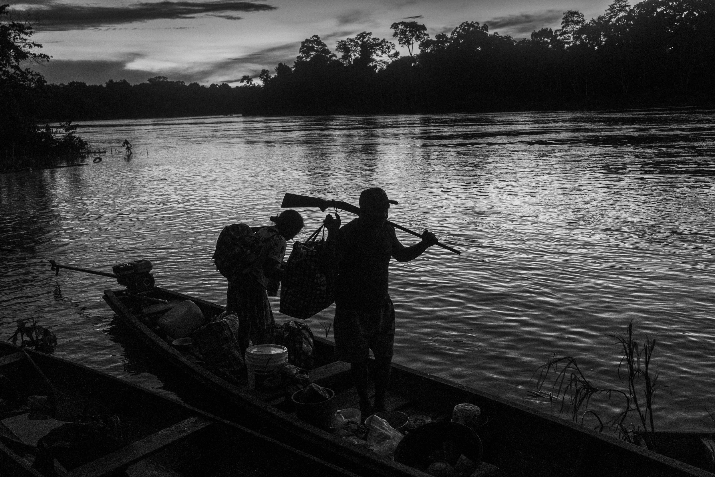 A Mayoruna family returns to their village after several days spent fishing and hunting along the Curuçá River in Brazil's Vale do Javari Indigenous Territory.