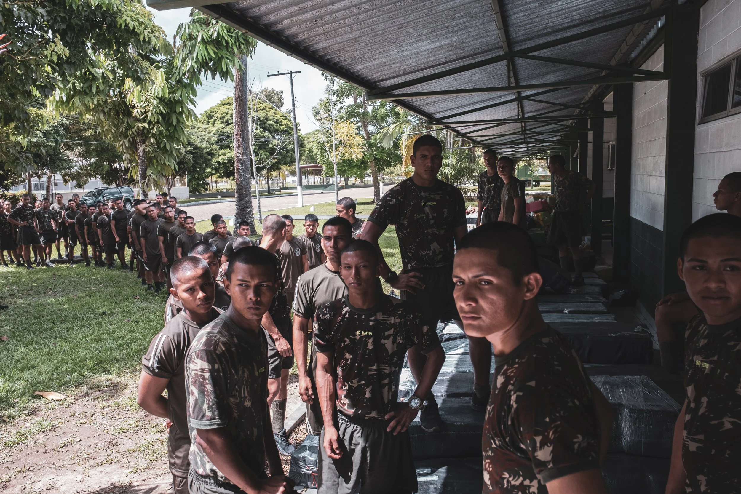 Recruits from the Brazilian Army’s 8th Battalion in Tabatinga transport 14 tons of confiscated marijuana inside the battalion headquarters before it is taken for destruction.