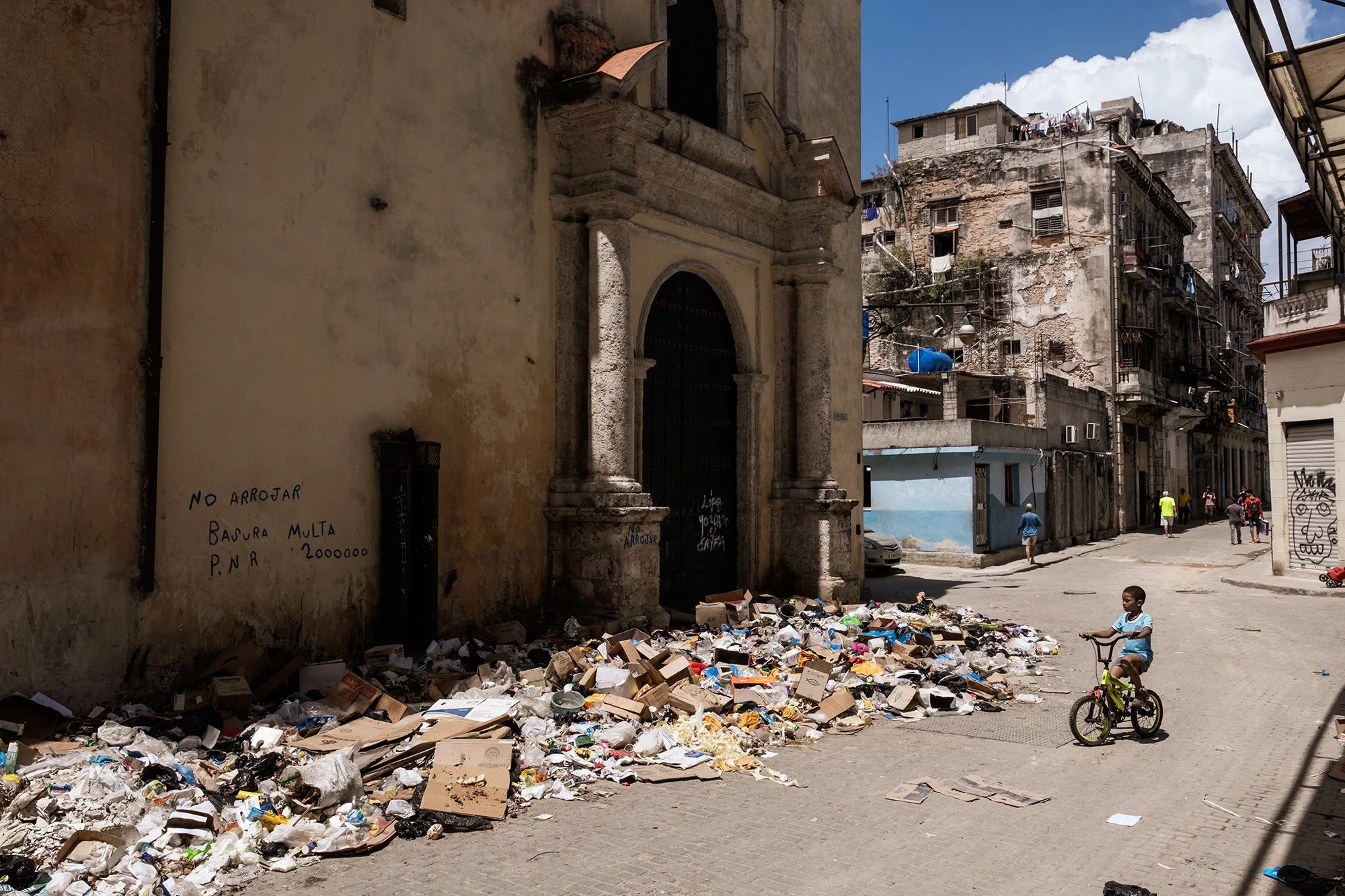 Piles of uncollected waste line a street in downtown Havana.