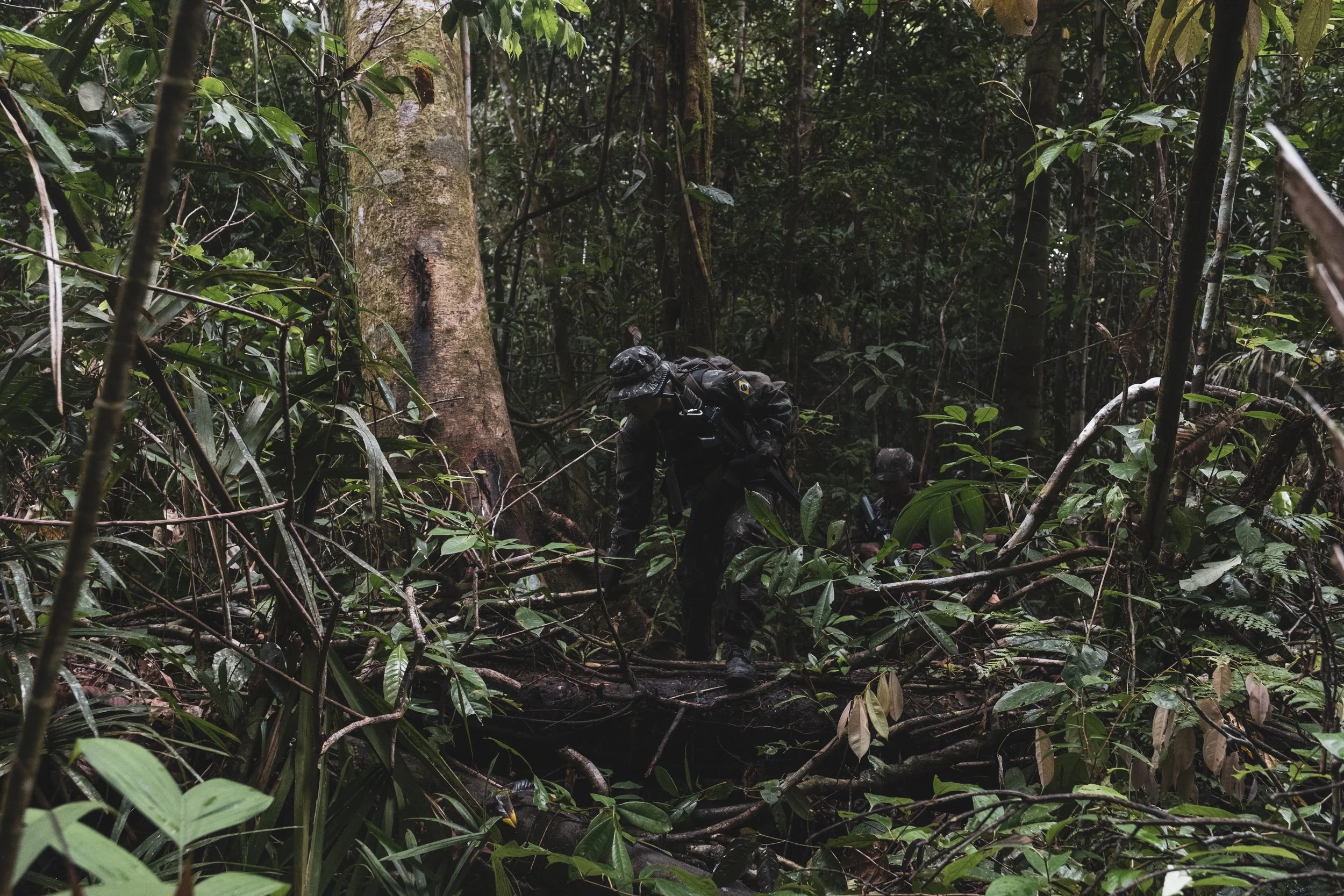 Members of the Brazilian Army’s special unit Selva patrol a jungle trail along the Colombian border where Brazilian forces recently engaged with the Colombian narco-guerrilla group Comando de la Frontera, accused of smuggling drugs into Brazil.