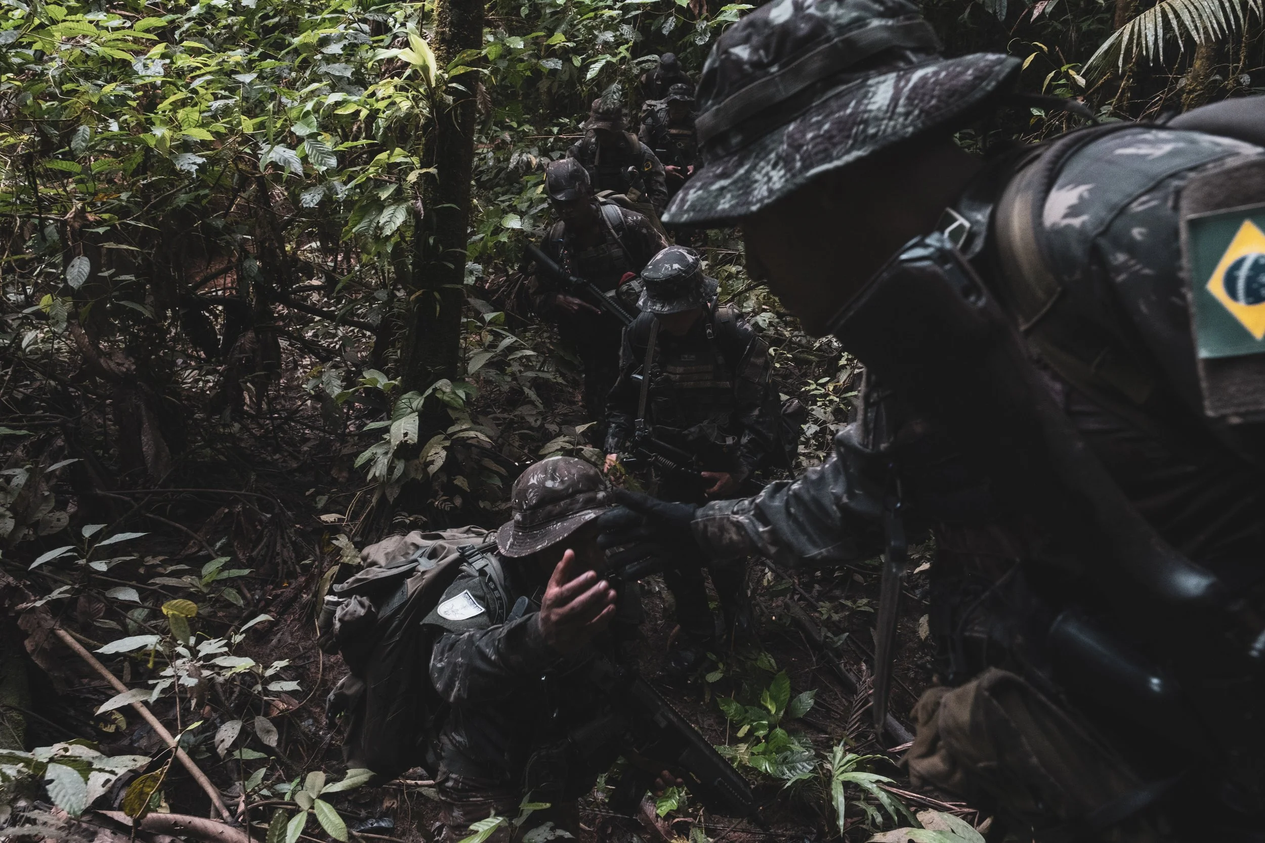 Members of the Brazilian Army’s special unit Selva patrol a jungle trail along the Colombian border where Brazilian forces recently engaged with the Colombian narco-guerrilla group Comando de la Frontera, accused of smuggling drugs into Brazil.