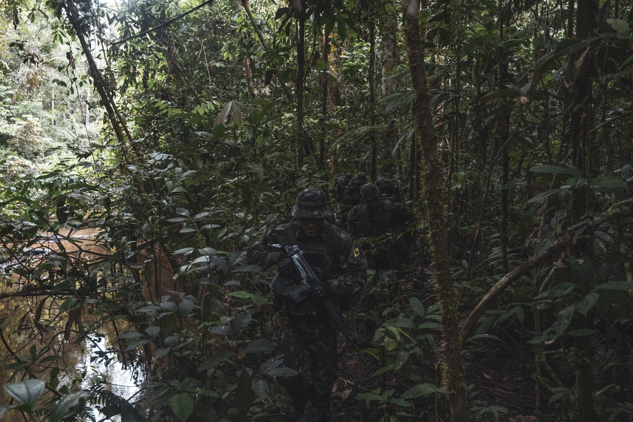 Members of the Brazilian Army’s special unit Selva patrol a jungle trail along the Colombian border where Brazilian forces recently engaged with the Colombian narco-guerrilla group Comando de la Frontera, accused of smuggling drugs into Brazil.