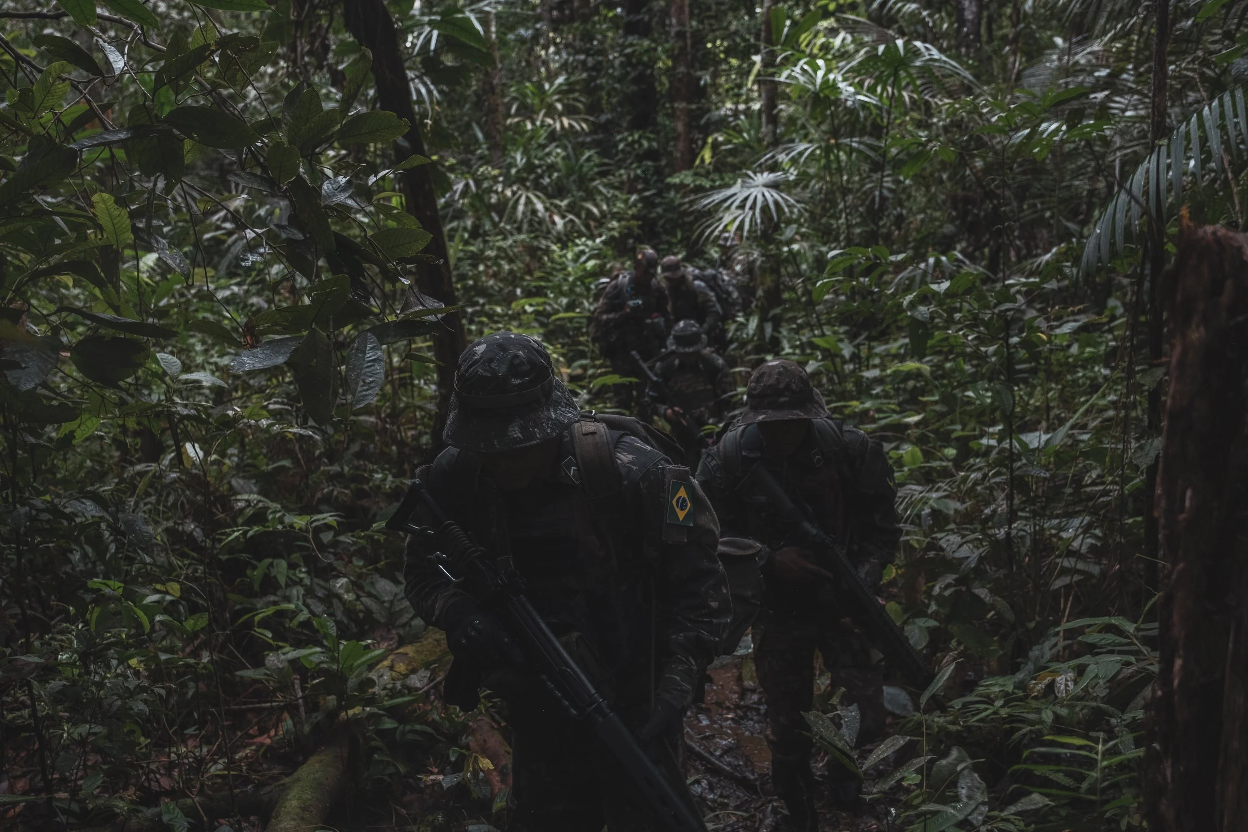 Members of the Brazilian Army’s special unit Selva patrol a jungle trail along the Colombian border where Brazilian forces recently engaged with the Colombian narco-guerrilla group Comando de la Frontera, accused of smuggling drugs into Brazil.