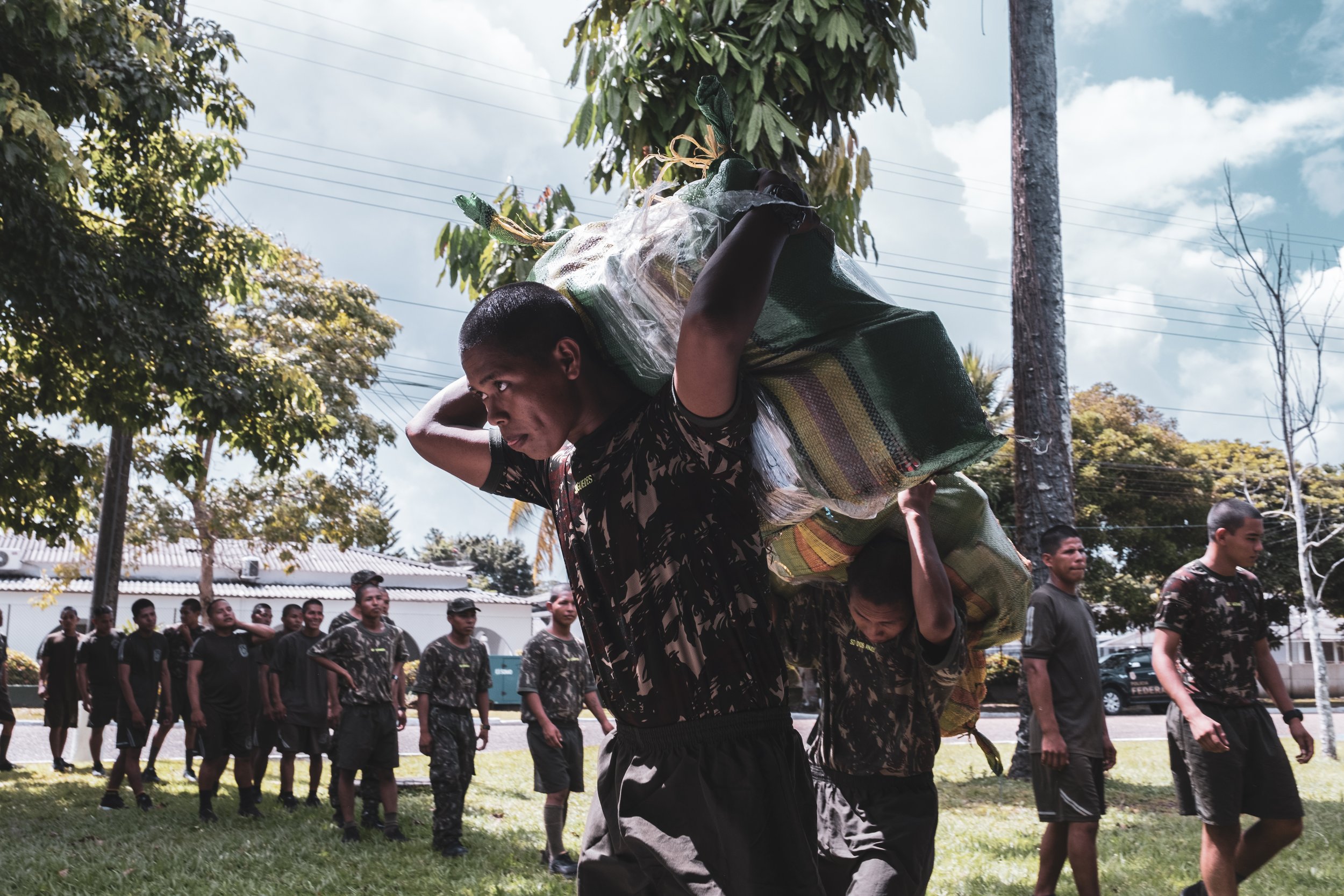 Recruits from the Brazilian Army’s 8th Battalion in Tabatinga transport 14 tons of confiscated marijuana inside the battalion headquarters before it is taken for destruction.