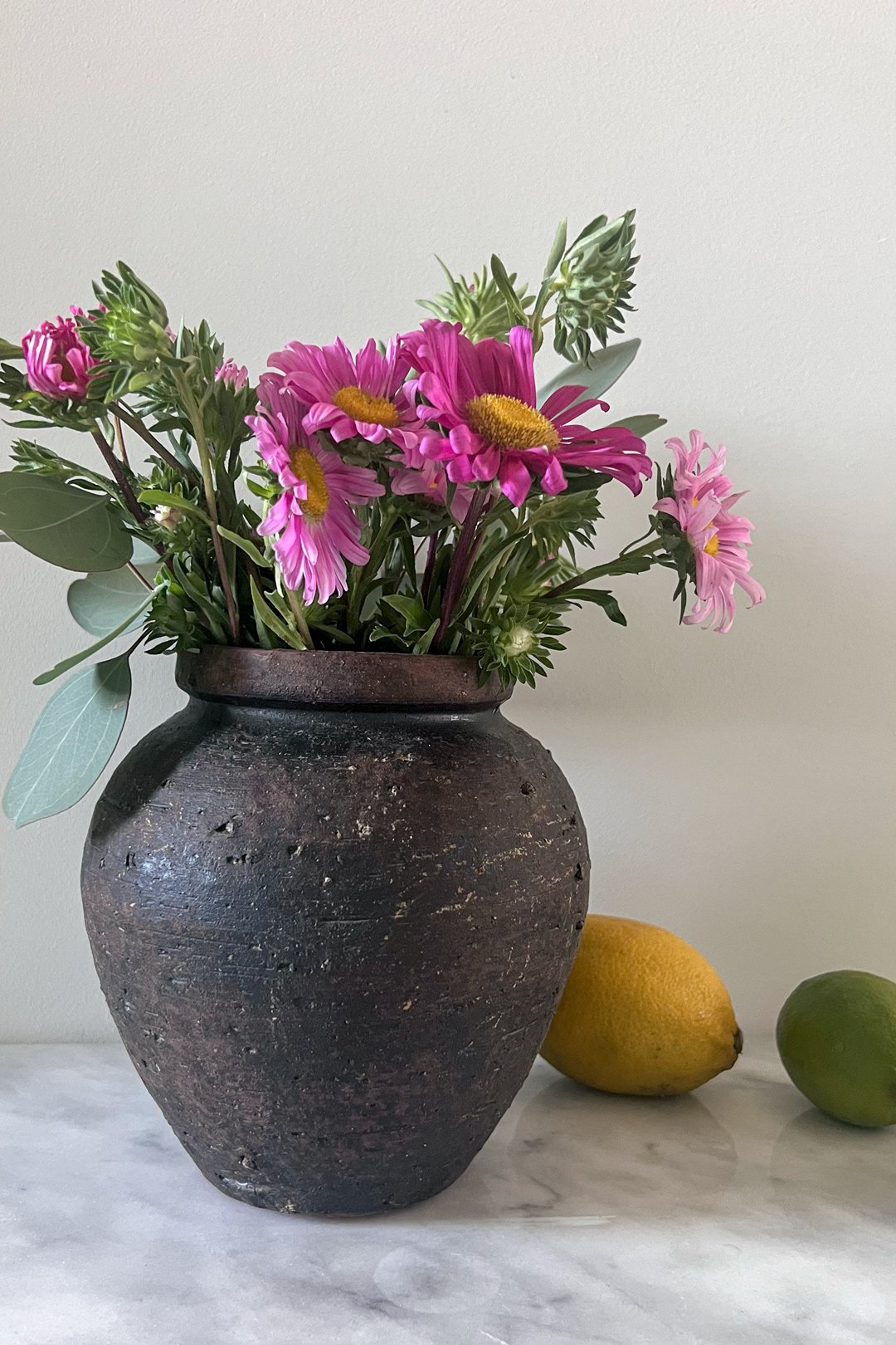 pink-flowers-dark-ceramic-vase-modern-home-styling.jpg