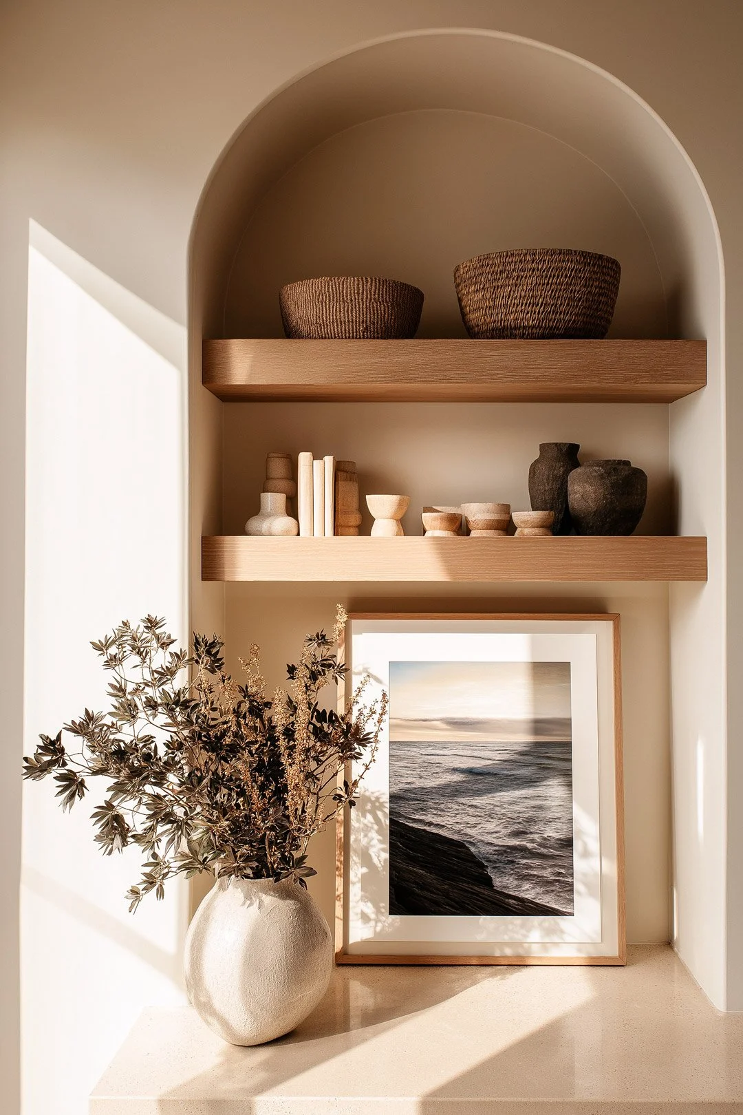 studio-sakaia-arched-niche-styling-warm-neutral-shelves.jpg