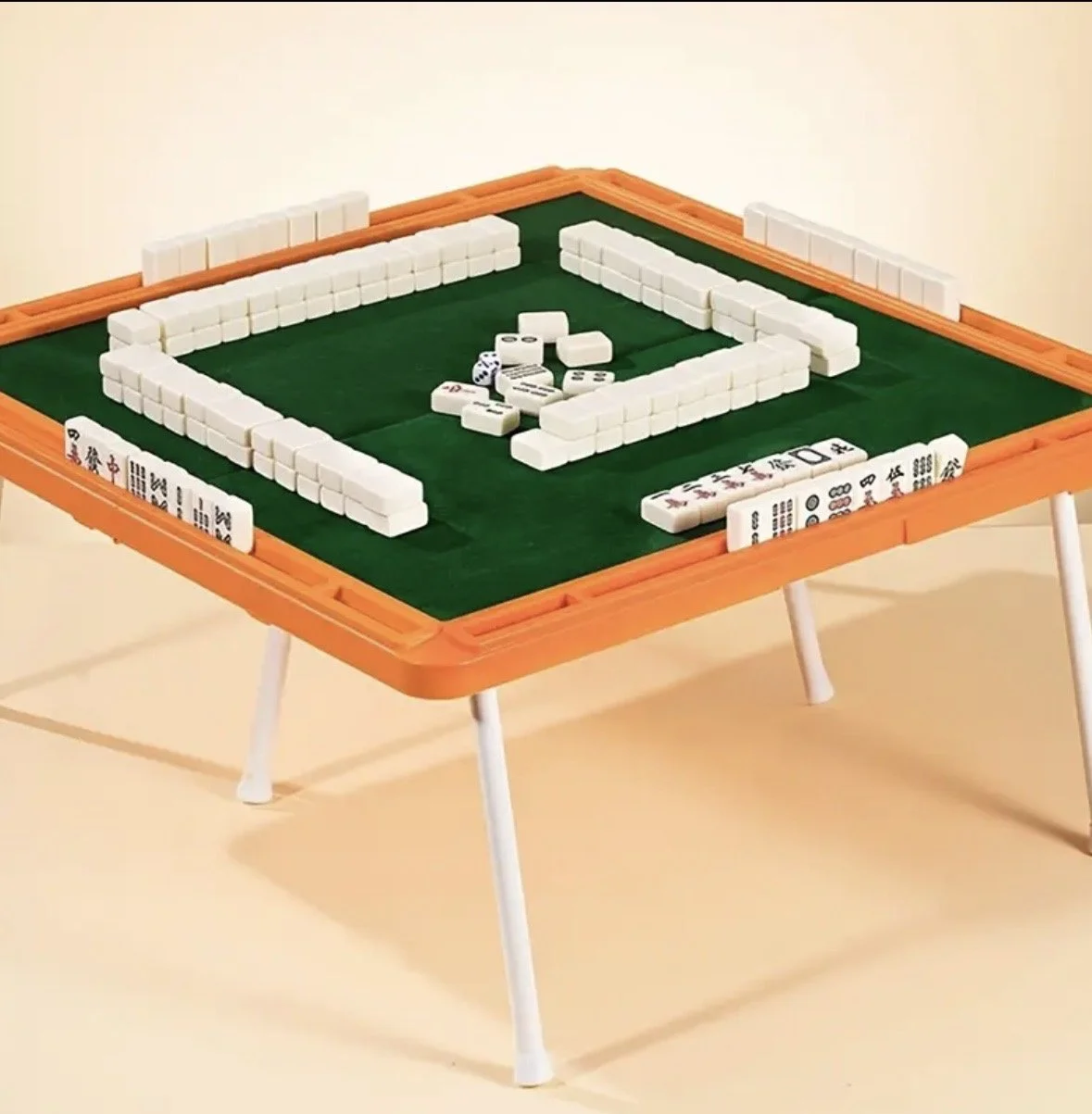 Portable Mahjong  table. Comes complete with a mini Mahj tile set and dice