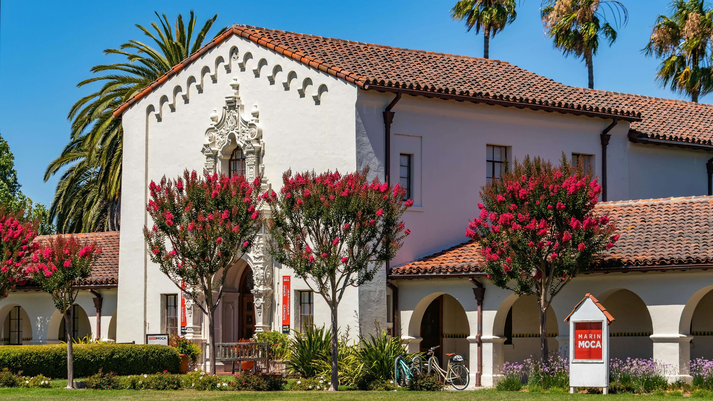 Spanish-style school building representing certified fire life safety services for California schools and public buildings.