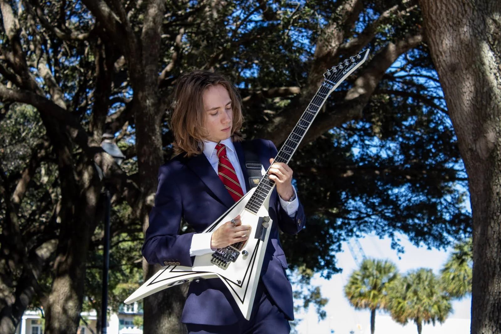 Guitar instructor playing electric guitar
