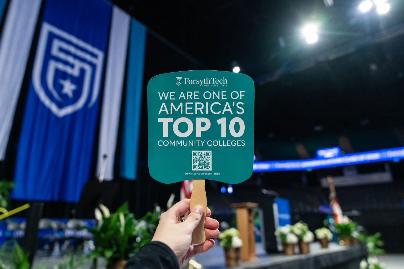A paper fan that says, "Forsyth Tech, We are one of America's Top 10 community colleges"