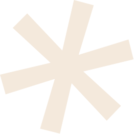 Abstract black background with beige geometric starburst shape.