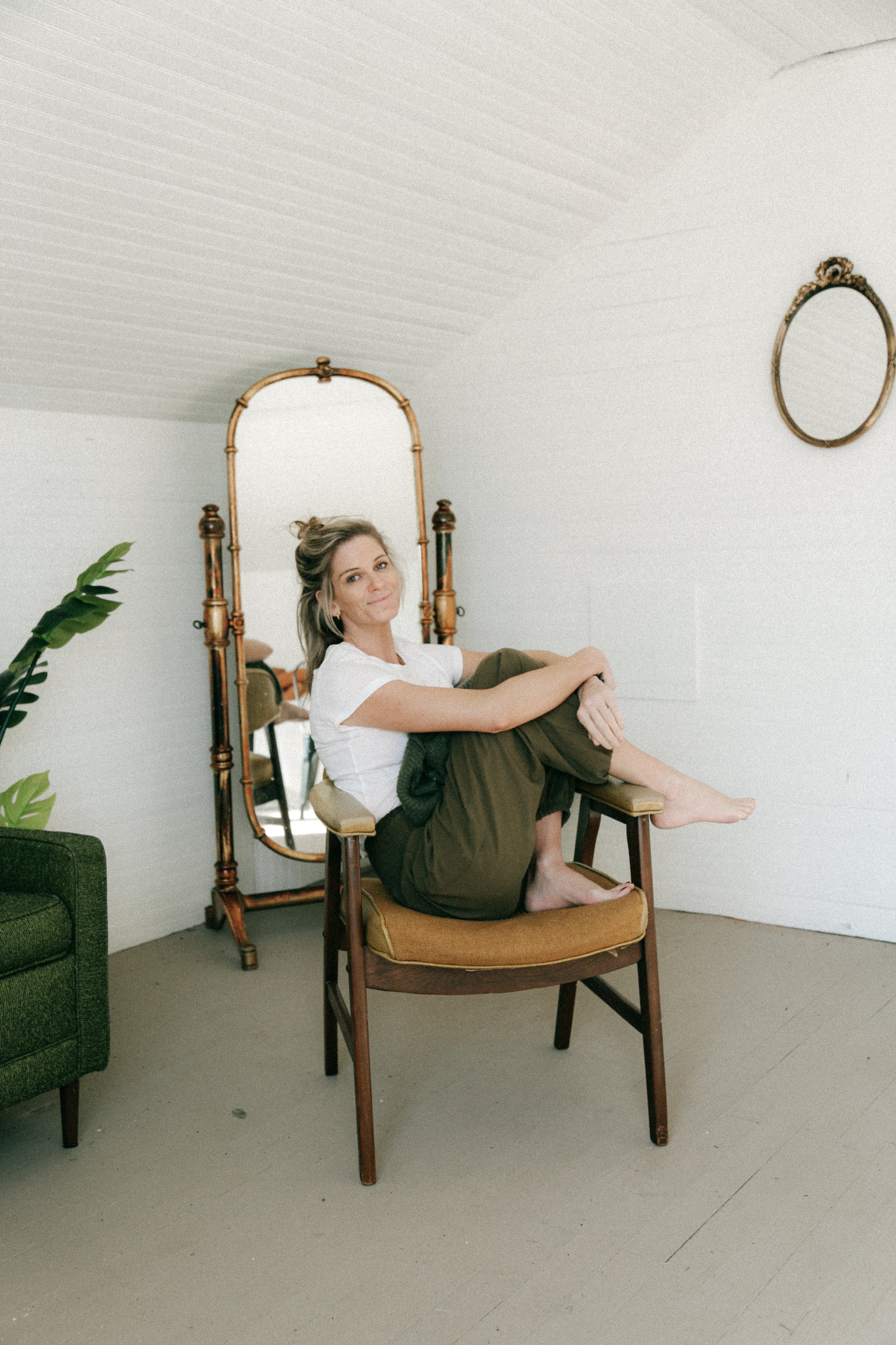 Professional Health Coach posed in of mirror.