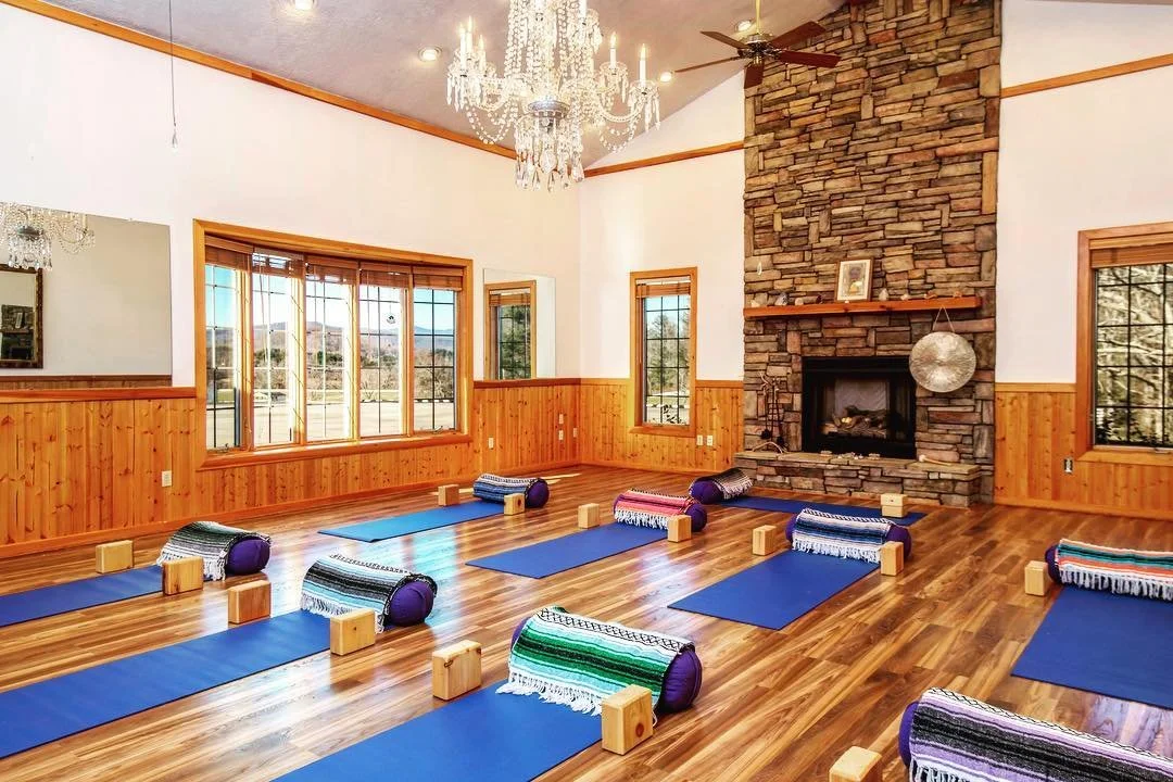 yoga studio with fireplace and mountains