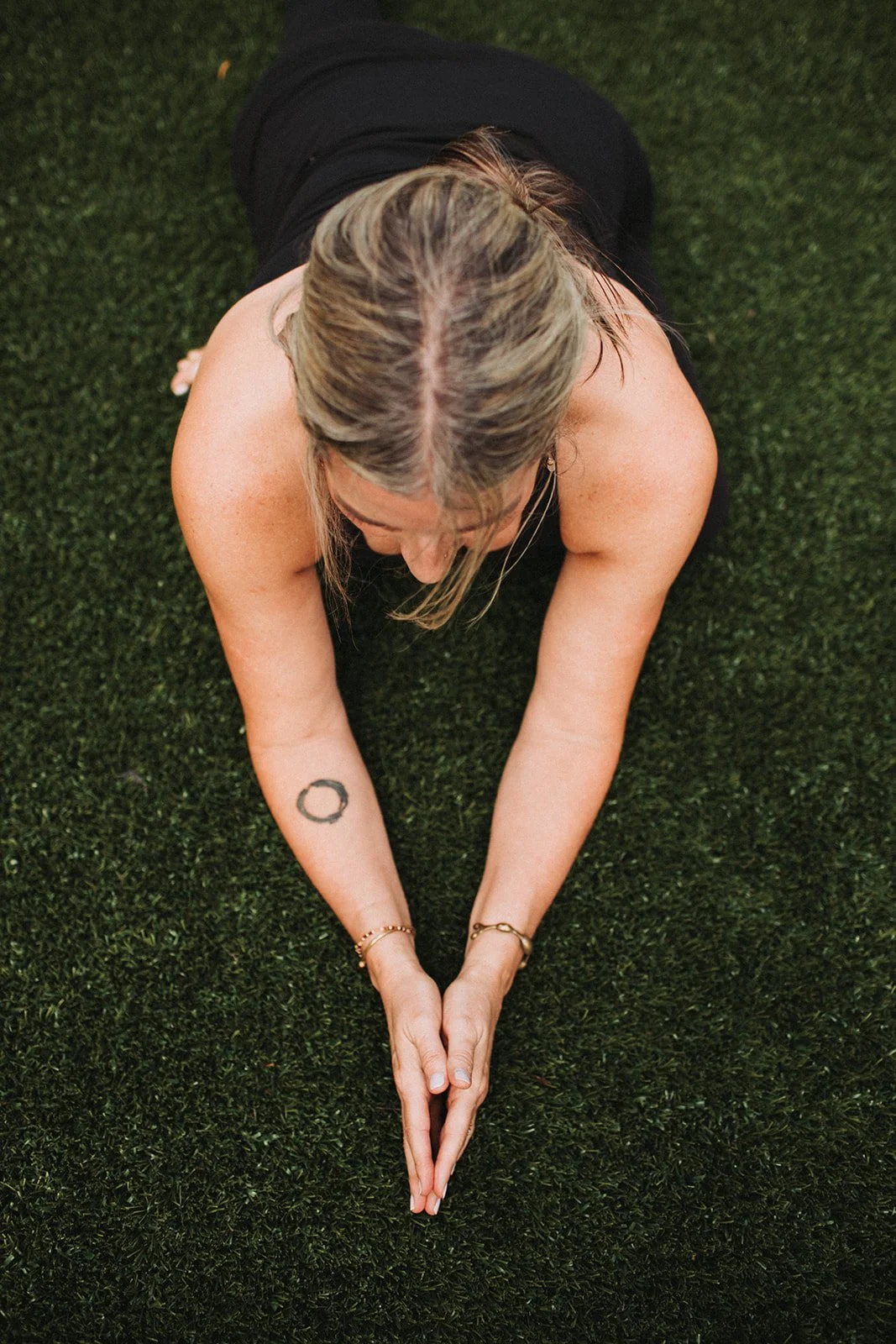 Hands together with enzo tattoo