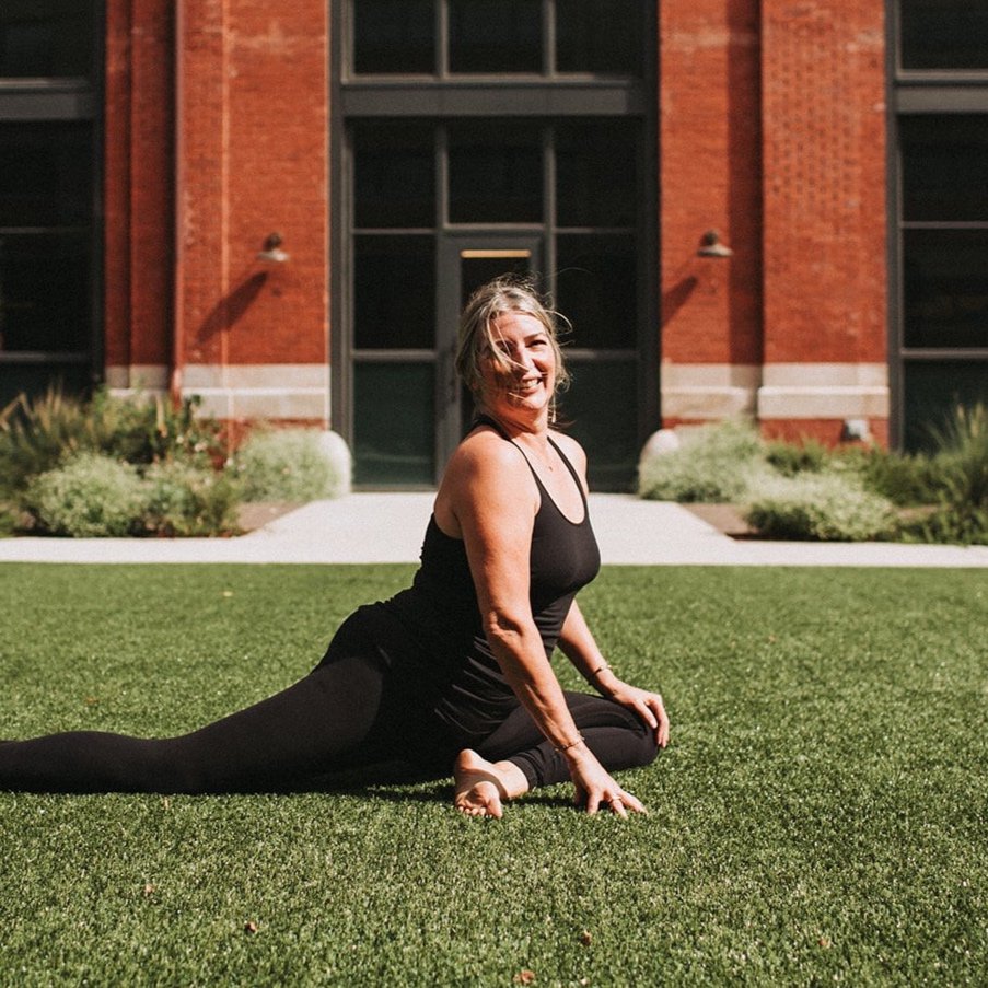 Yoga pigeon pose in the park
