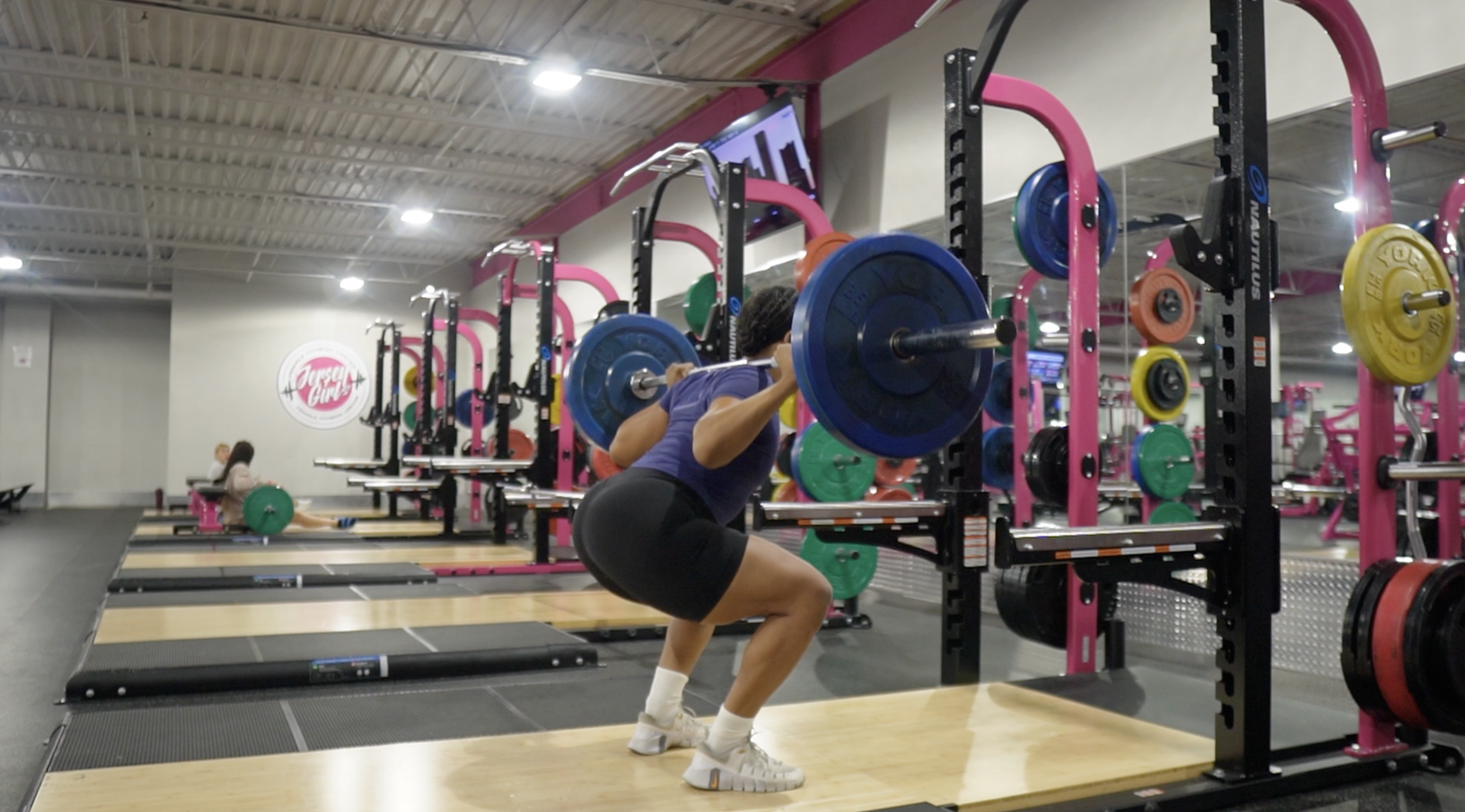 Deonah strength training with a barbell