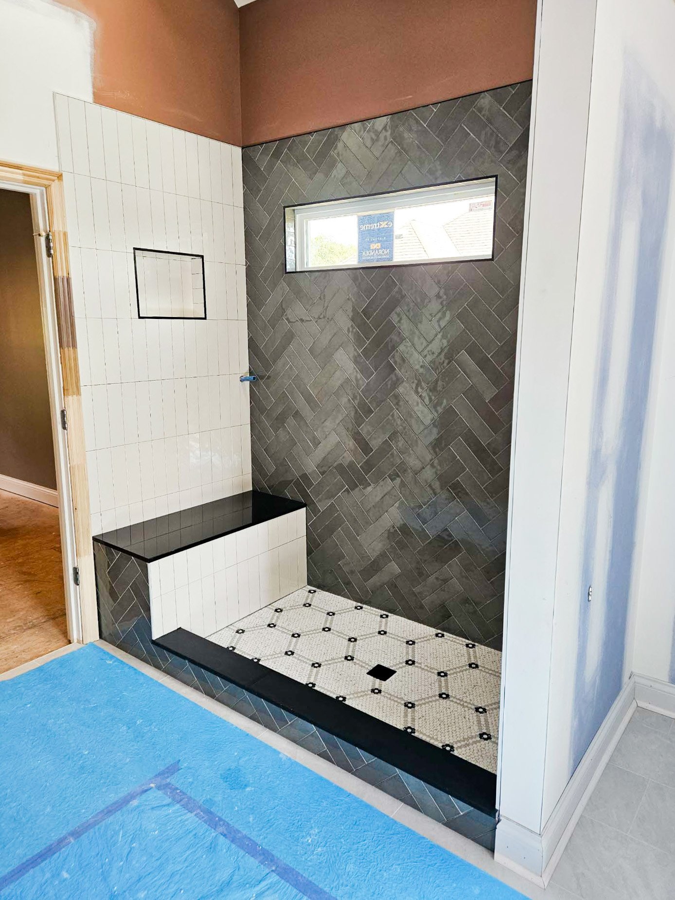 Grey and White Shower tile with hexagon floor