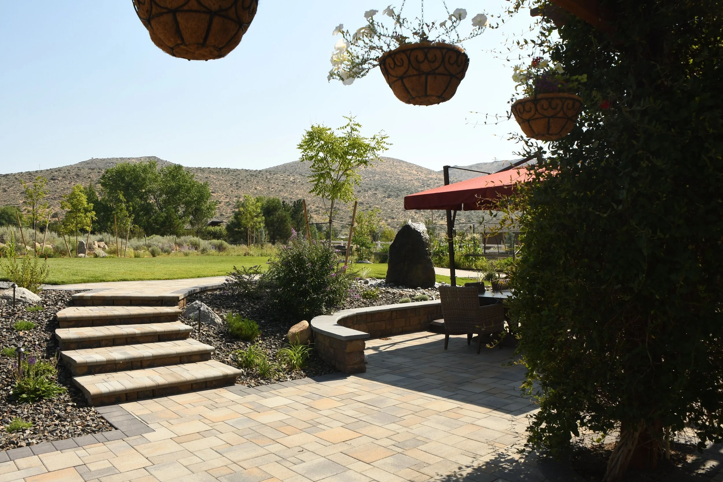 The Many Uses of a Retaining Wall in an Outdoor Kitchen and Dining Space in Carson City NV