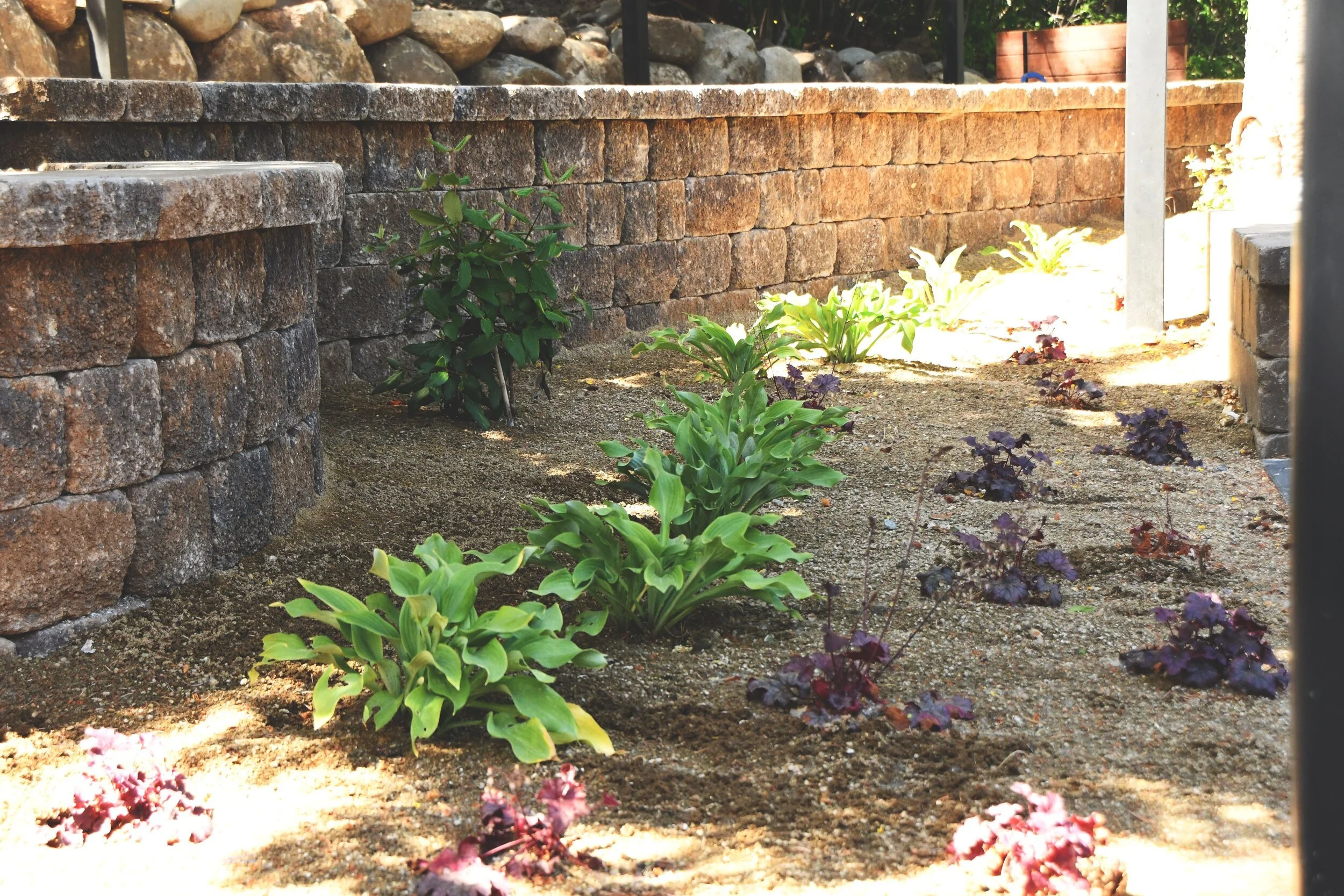 How Landscaping Services Protect and Preserve a Retaining Wall and Other Hardscaping Features in Reno NV