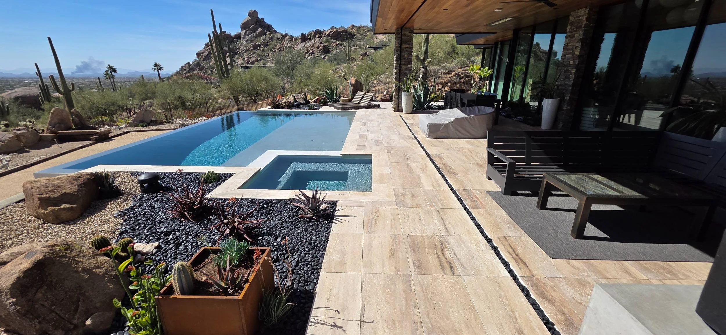 A luxury backyard featuring custom pool designs and outdoor living in Scottsdale, AZ