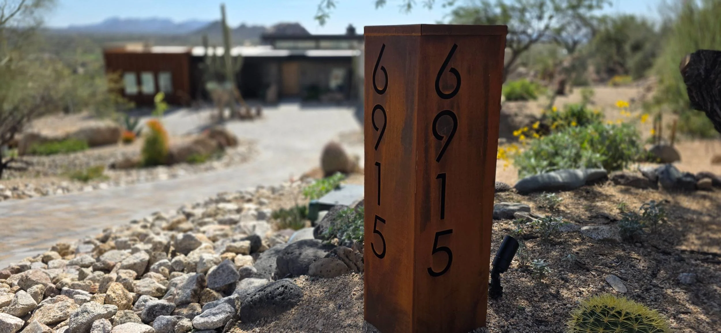 A high-end outdoor living area with custom outdoor kitchen in Anthem, AZ