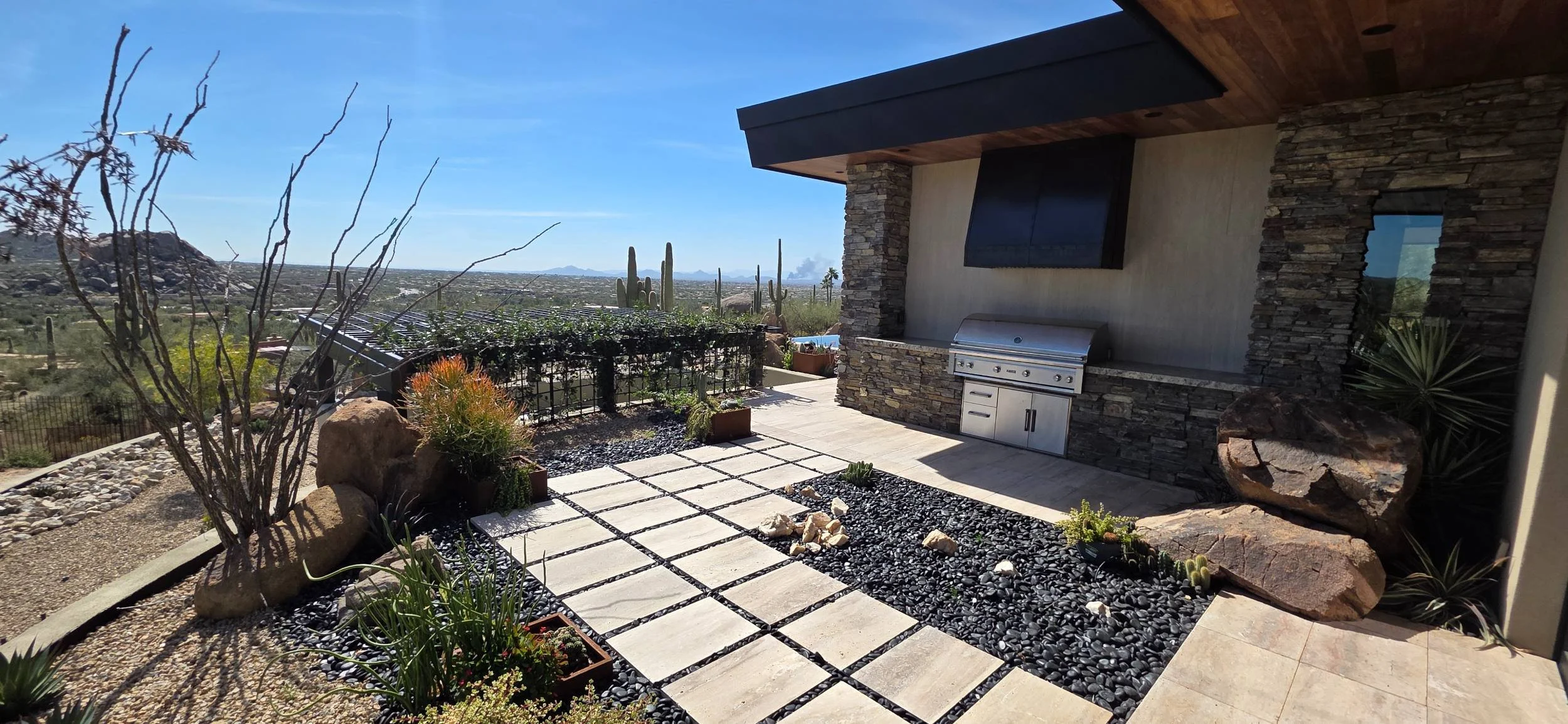 A resort-style poolscape with integrated shade structures in Scottsdale, AZ