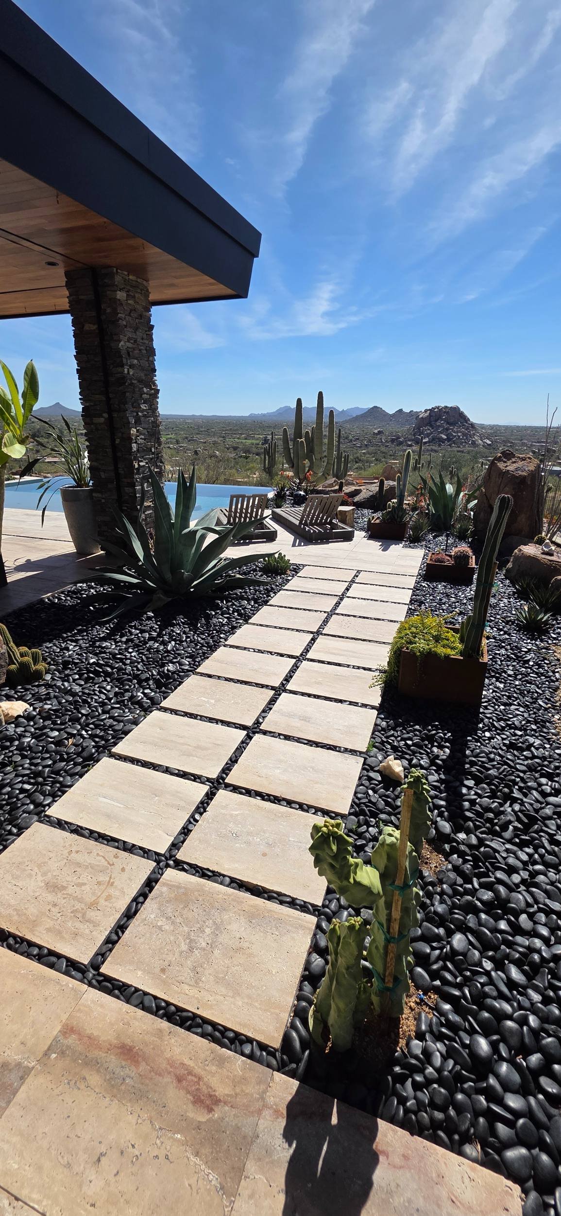 A custom landscape design with front yard landscaping and desert plantings in Carefree, AZ