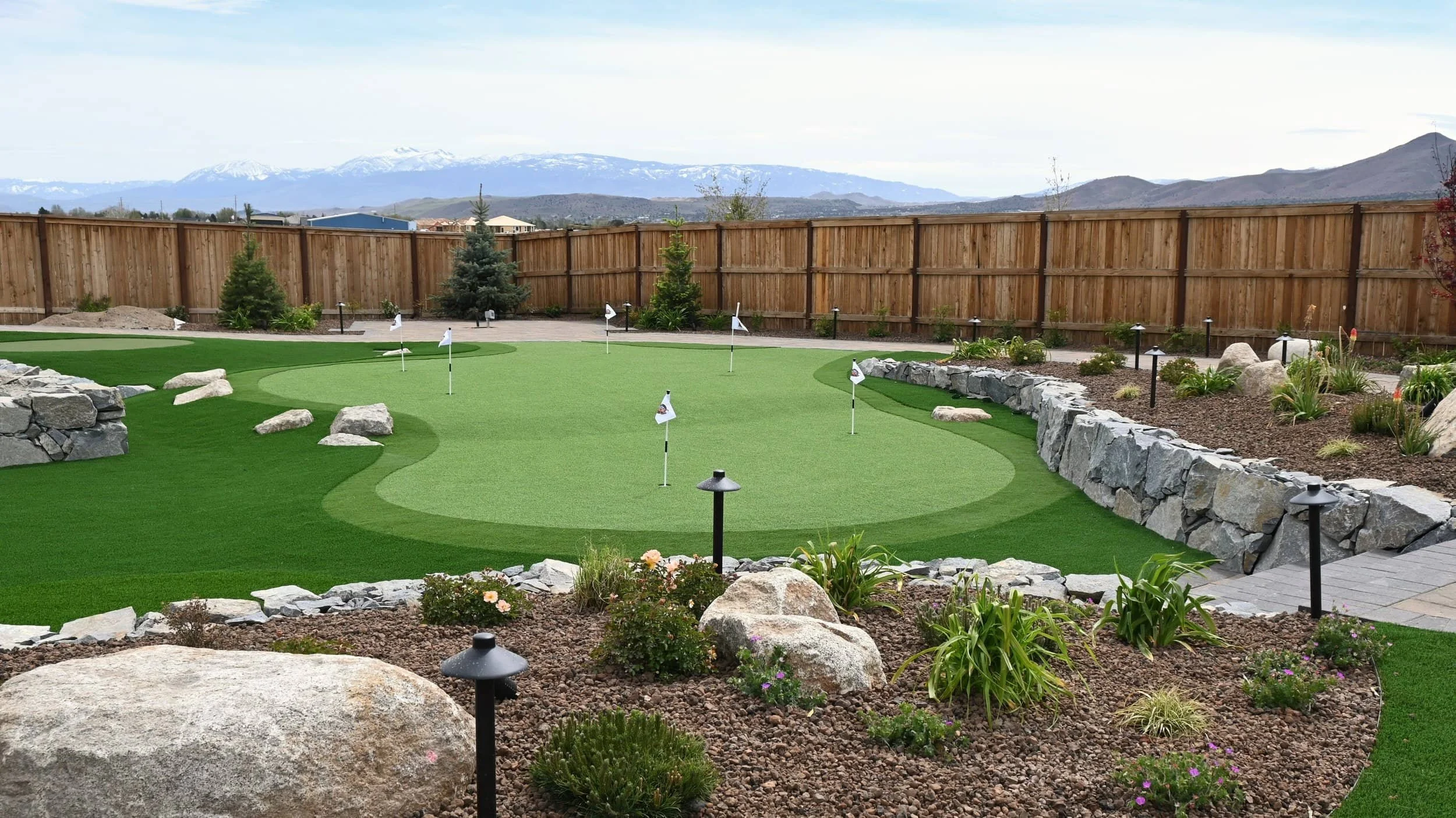 Leisure Backyard Design With Outdoor Kitchen and Fire Pit in Carson City, NV