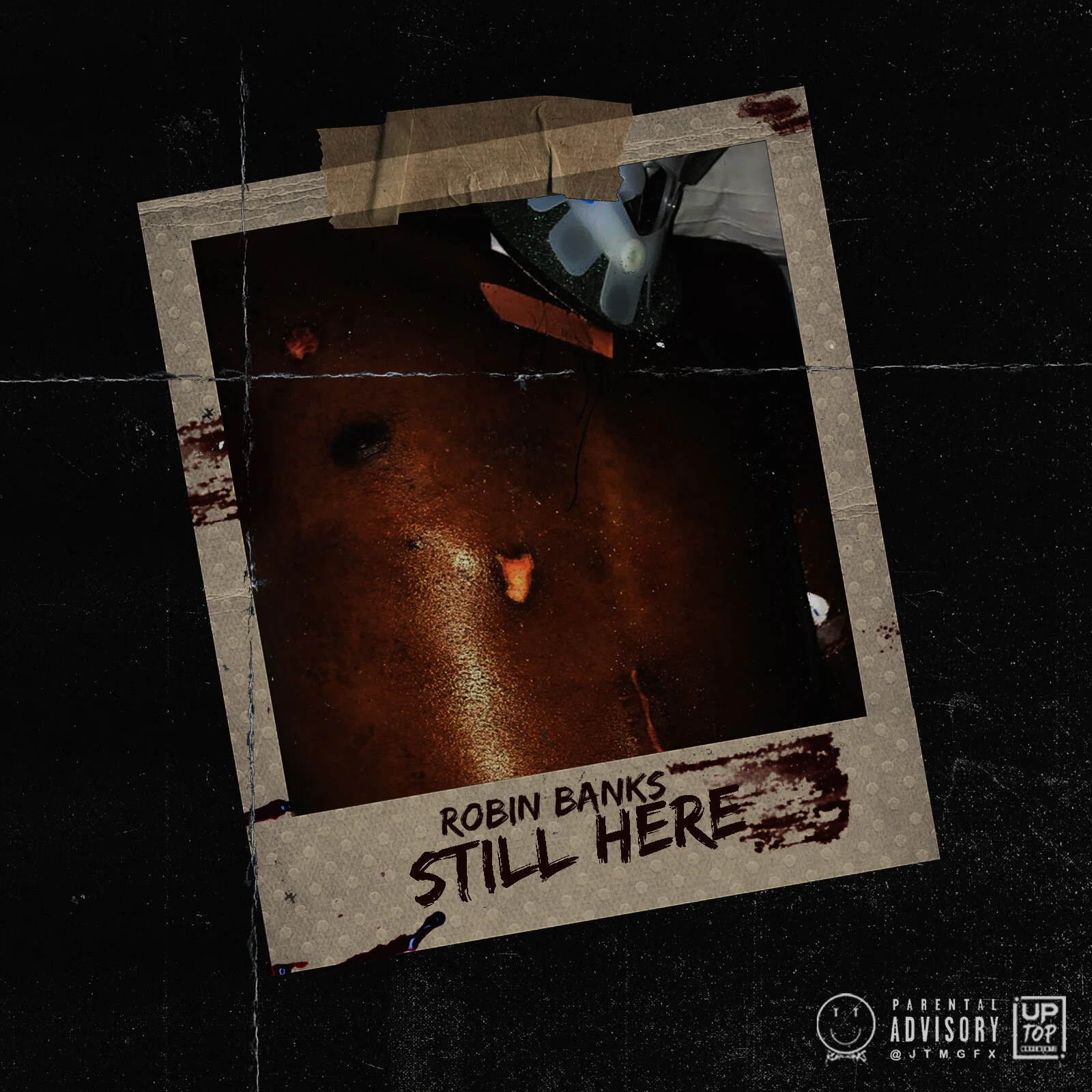 A dark, gritty photo of a human torso with some bloodstains, taped to a surface with the words "Robin Banks Still Here" written on a photo frame at the bottom.