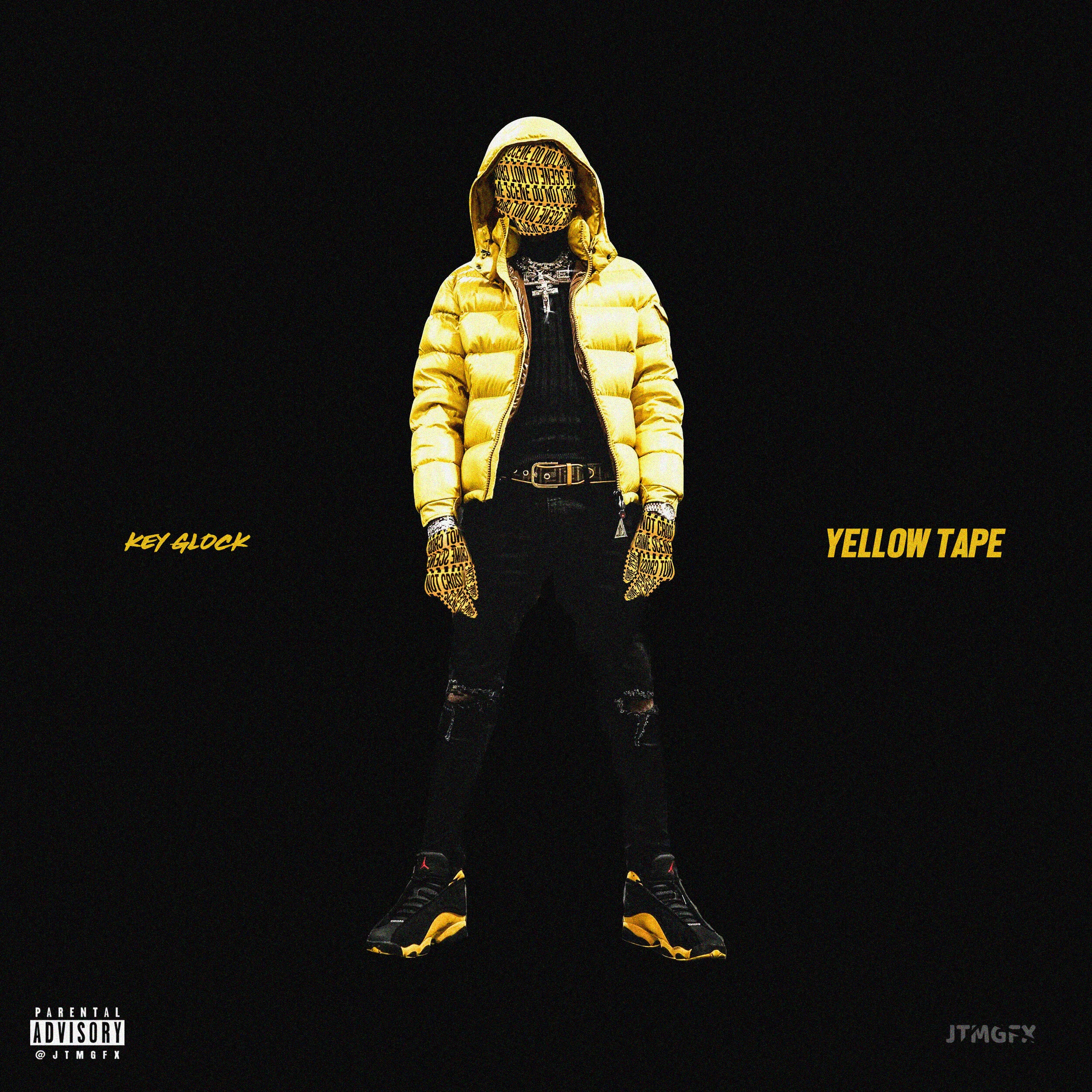 Person wearing a yellow puffer jacket, black ripped jeans, and black and yellow sneakers, with yellow tape over their face and gloves with yellow and black writing, standing against a black background with the text 'Key Glock' on the left and 'Yellow
