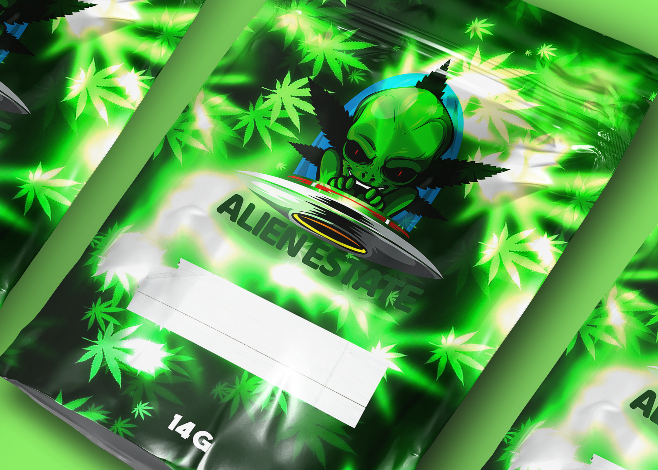 Packaging with a green background featuring marijuana leaf patterns, a cartoon alien with large eyes and a mischievous expression, wearing headphones, next to a flying saucer, and the text 'ALIEN ESTATE' below.