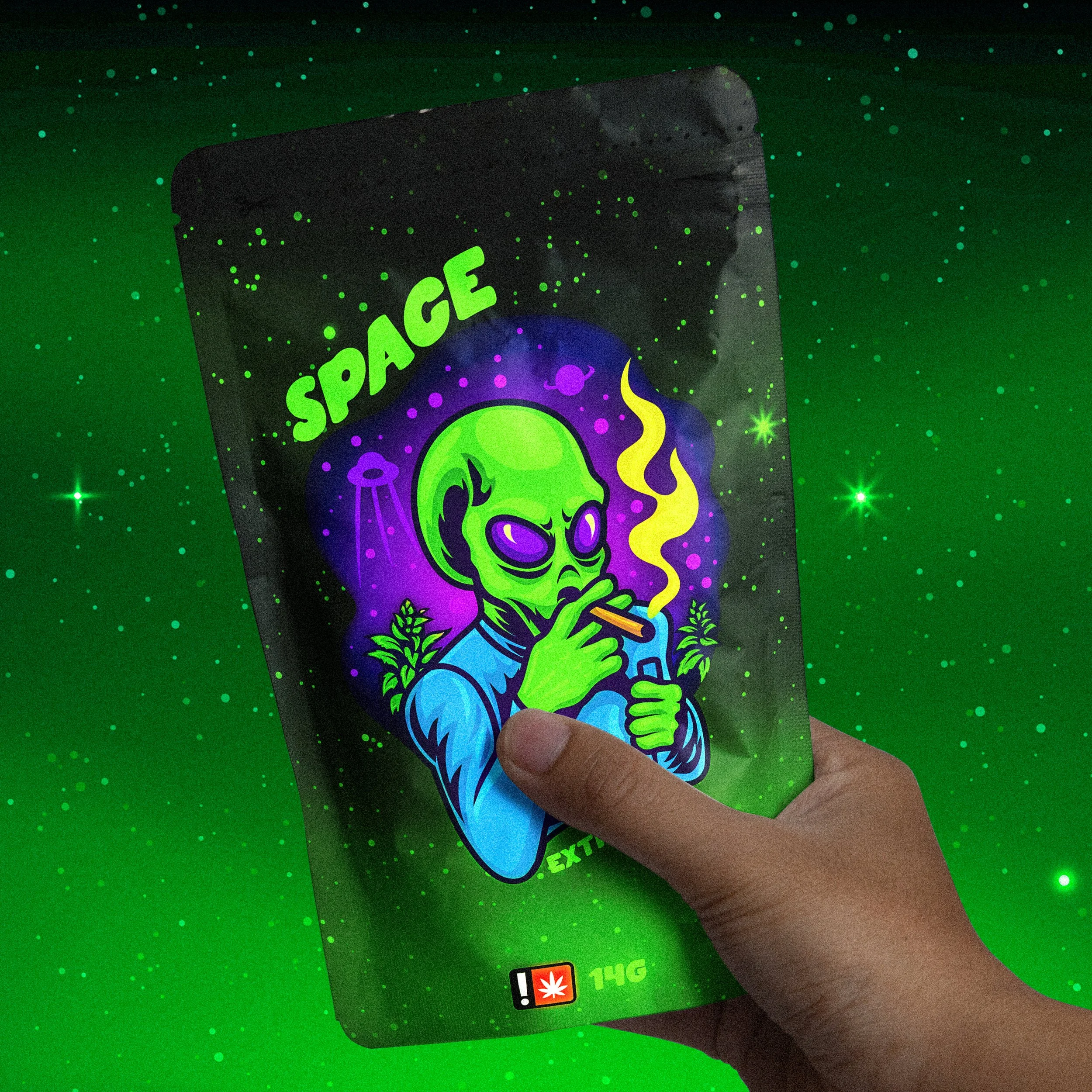 A hand holding a colorful packet labeled 'SPACE' with a cartoon alien smoking a cigarette, standing against a glowing green background with star-like specks.