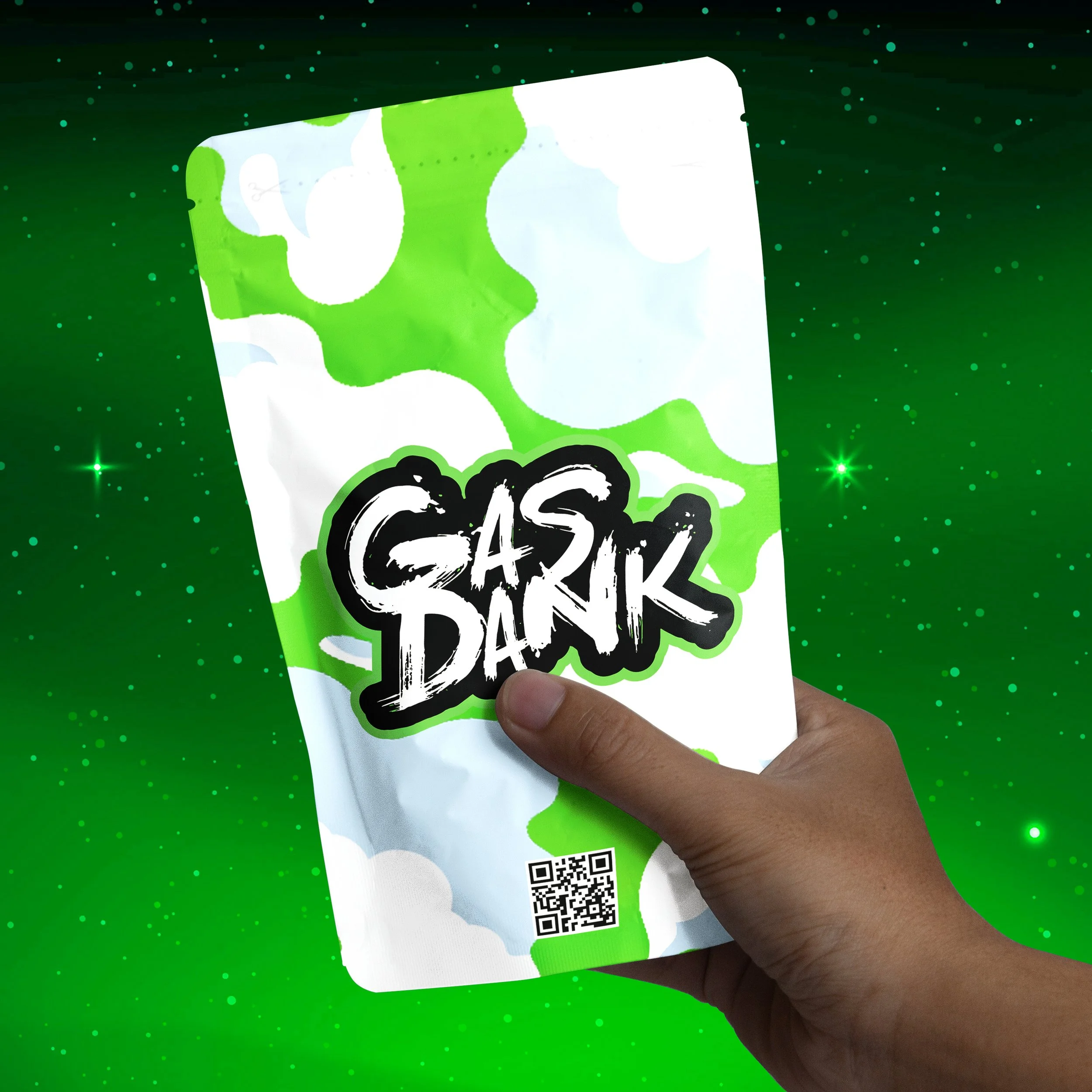 Hand holding a packet with green, white, and black graffiti-style text that reads "GASK DARK" against a green cosmic background with stars and sparkles.