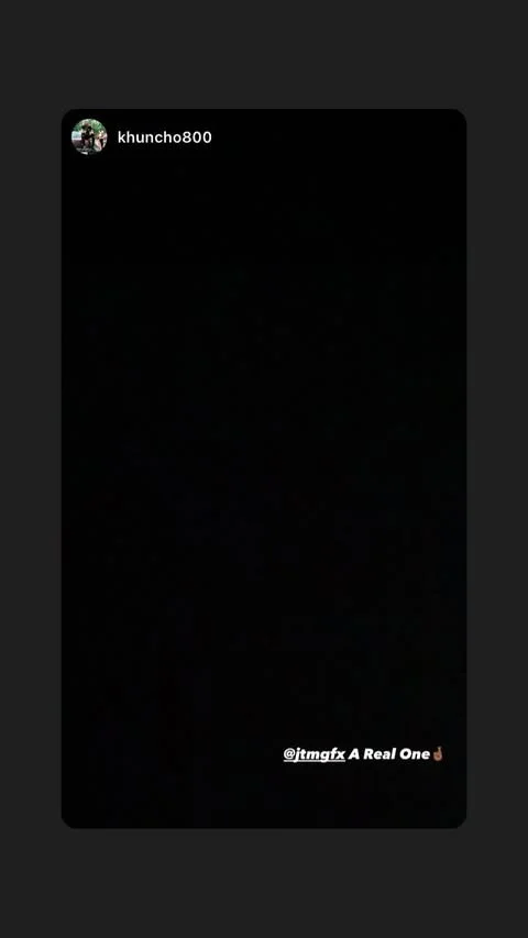 A nearly black image with social media overlay text reading '@jtmgfx A Real One' and a user handle 'khuncho800' at the top.