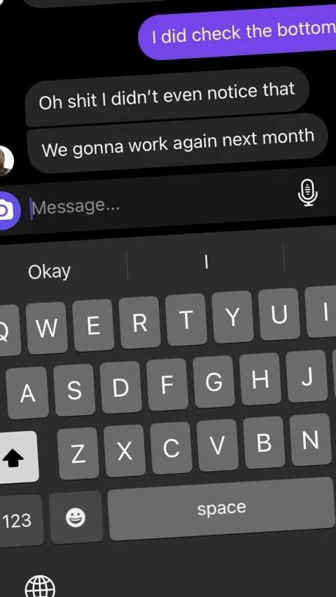 Screenshot of a text message conversation on a mobile phone showing a reply and a typed response in a messaging app with a black background and a keyboard visible.
