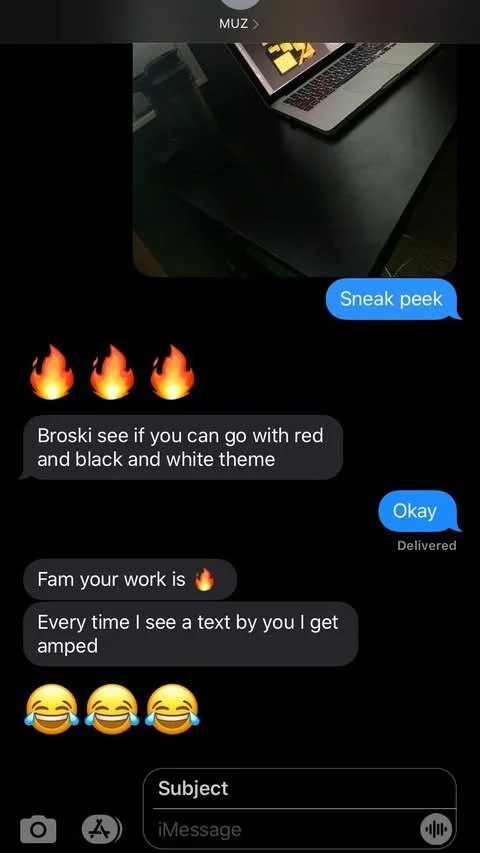 A screenshot of a text message conversation about designing a website theme with a laptop in the background. The conversation includes emojis of fire and laughing faces.