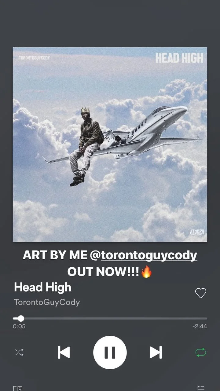 A person with a crown and sunglasses sitting on a private jet flying in the clouds during daytime, with blue sky and white clouds in the background.