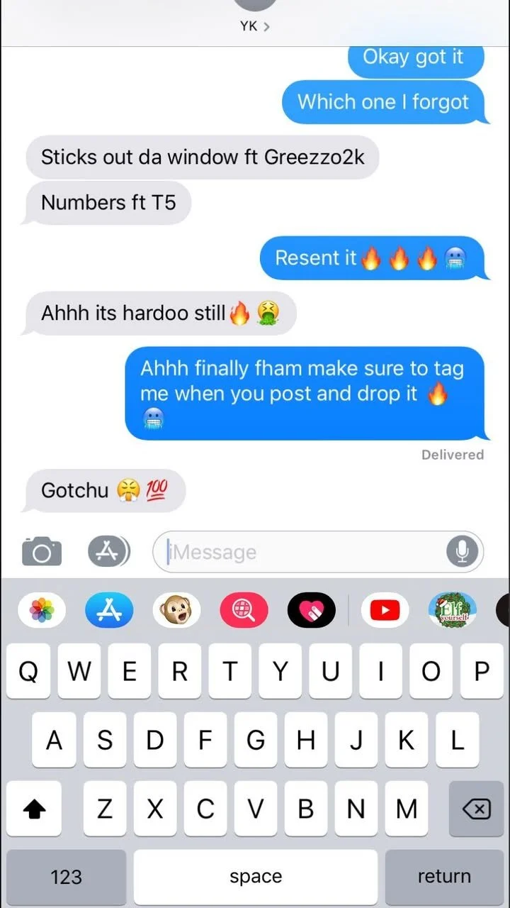 Screenshot of a chat conversation about music, with emojis and a visible keyboard on a smartphone.