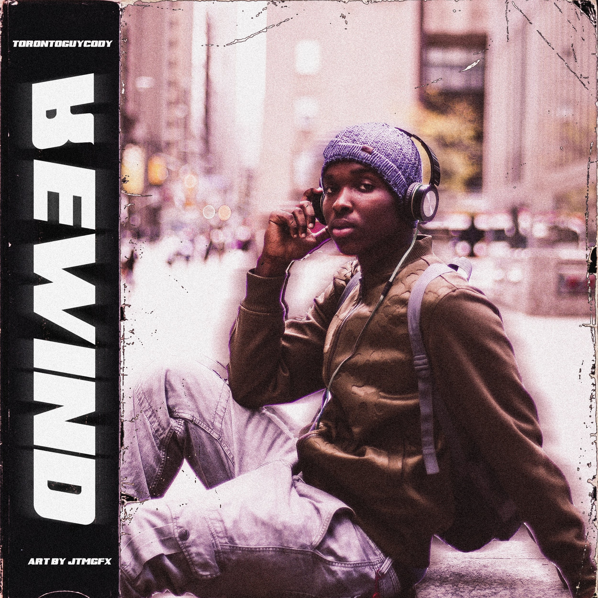 A young man sitting on a city street curb, wearing a blue knit beanie, brown jacket, and gray pants, listening to music with over-ear headphones, with a backpack on his shoulder, in an urban environment with blurred buildings and lights in the backgr