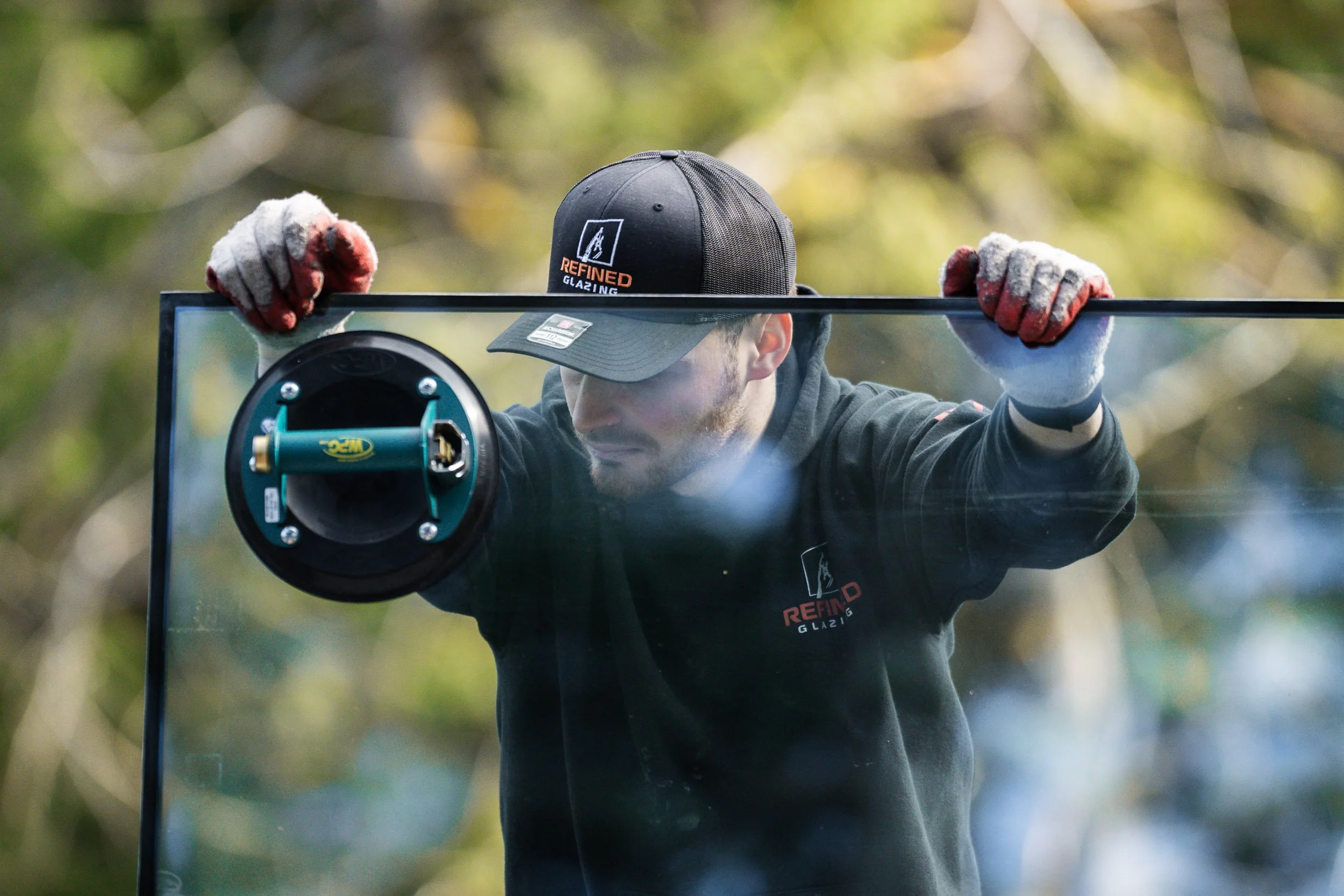 Refined Glazing crew installing windows on an active construction site in Squamish