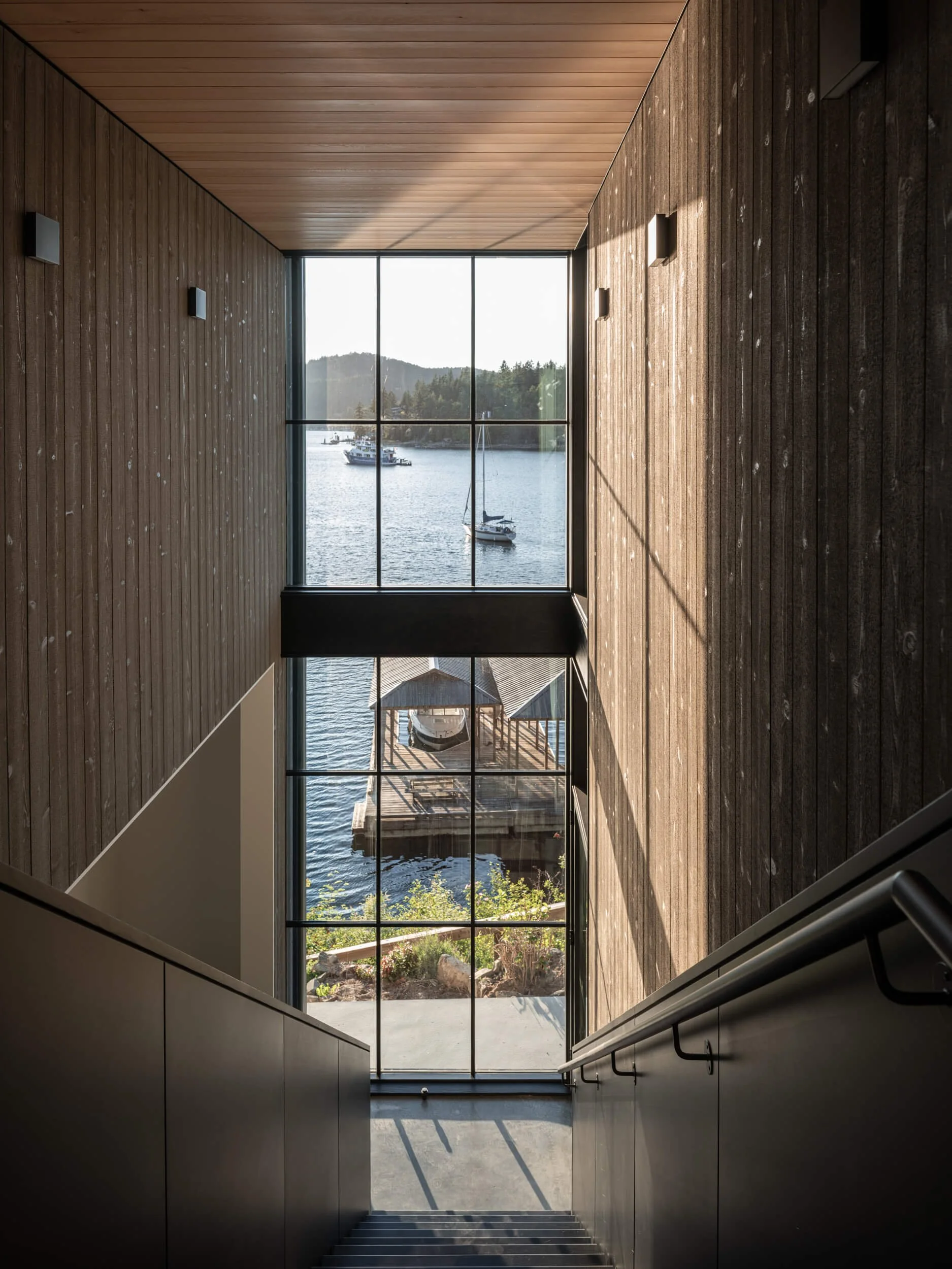 johnstone-road-madeira-park-stairwell-window-over-the-bay-architectural-photographer-matt-anthony.jpg