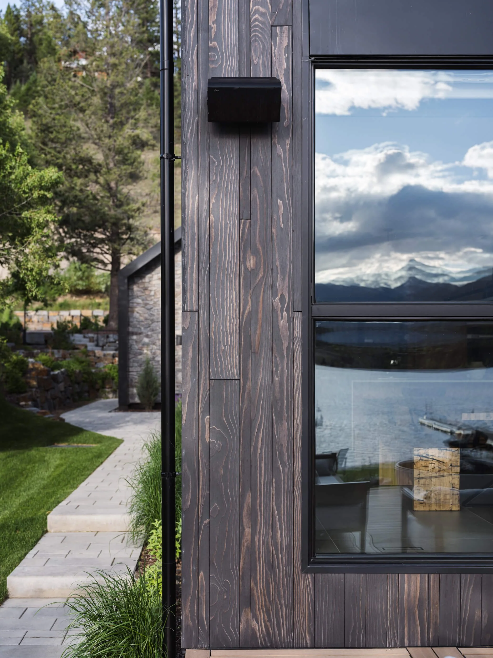 coleman-residence-invermere-wood-siding-window-lake-reflection-architectural-photographer-matt-anthony.jpg