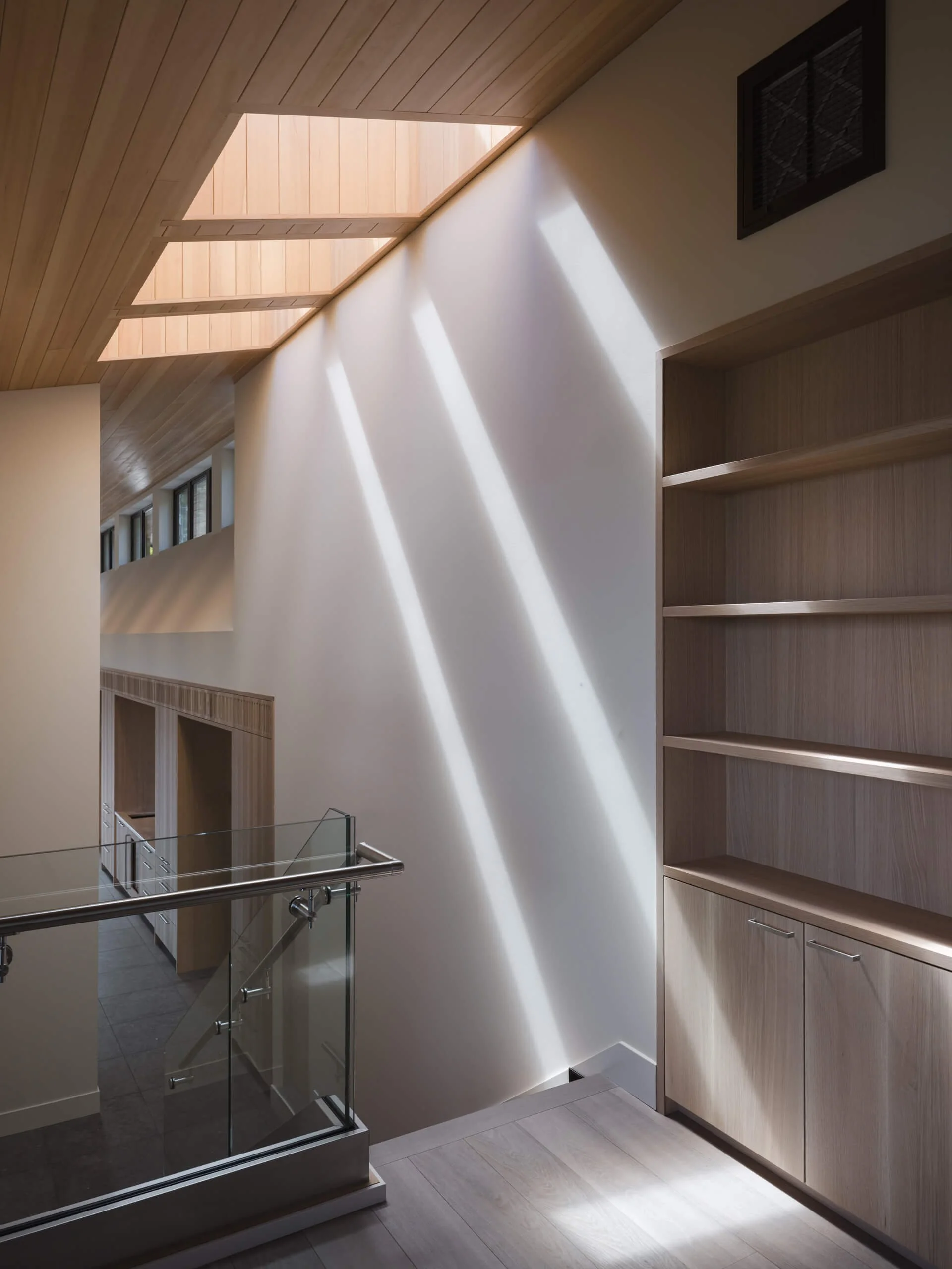 desolation-sound-residence-landing-light-shafts-bookshelf-architectural-photographer-matt-anthony.jpg